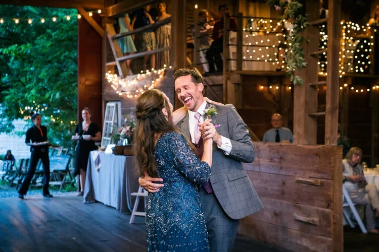 A couple dancing and laughing at a wedding reception at Rocklands Farm Winery