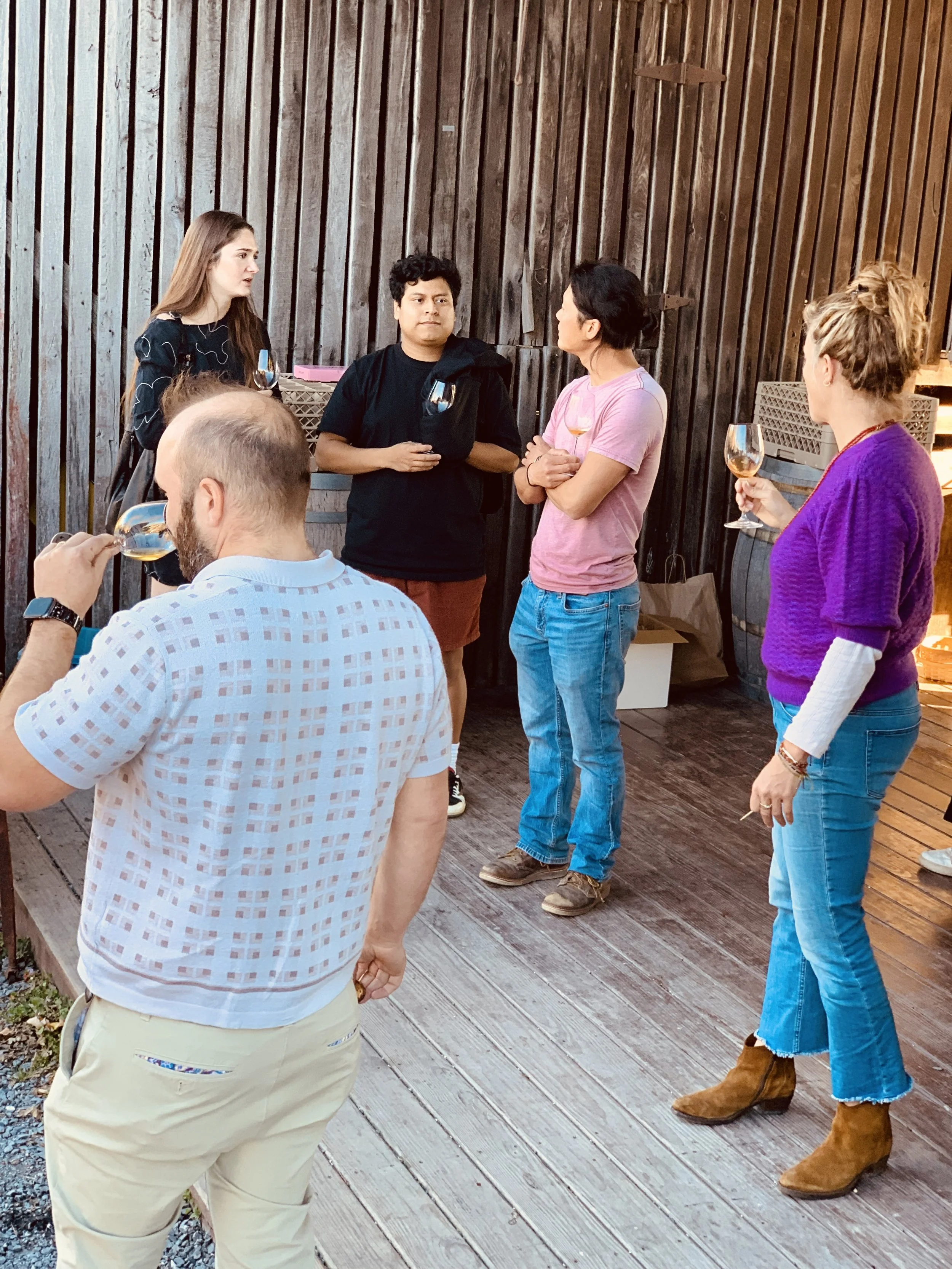 Group of five adults in the tasting room at Rocklands Farm Winery
