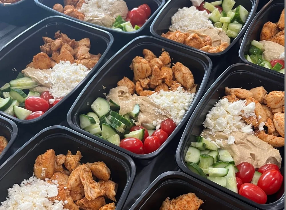 Classic Greek Street meal with chicken, hummus, cucumber, tomatoes and feta