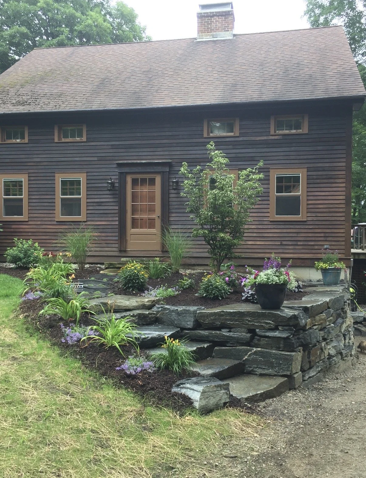 natural stone retaining wall and walkway