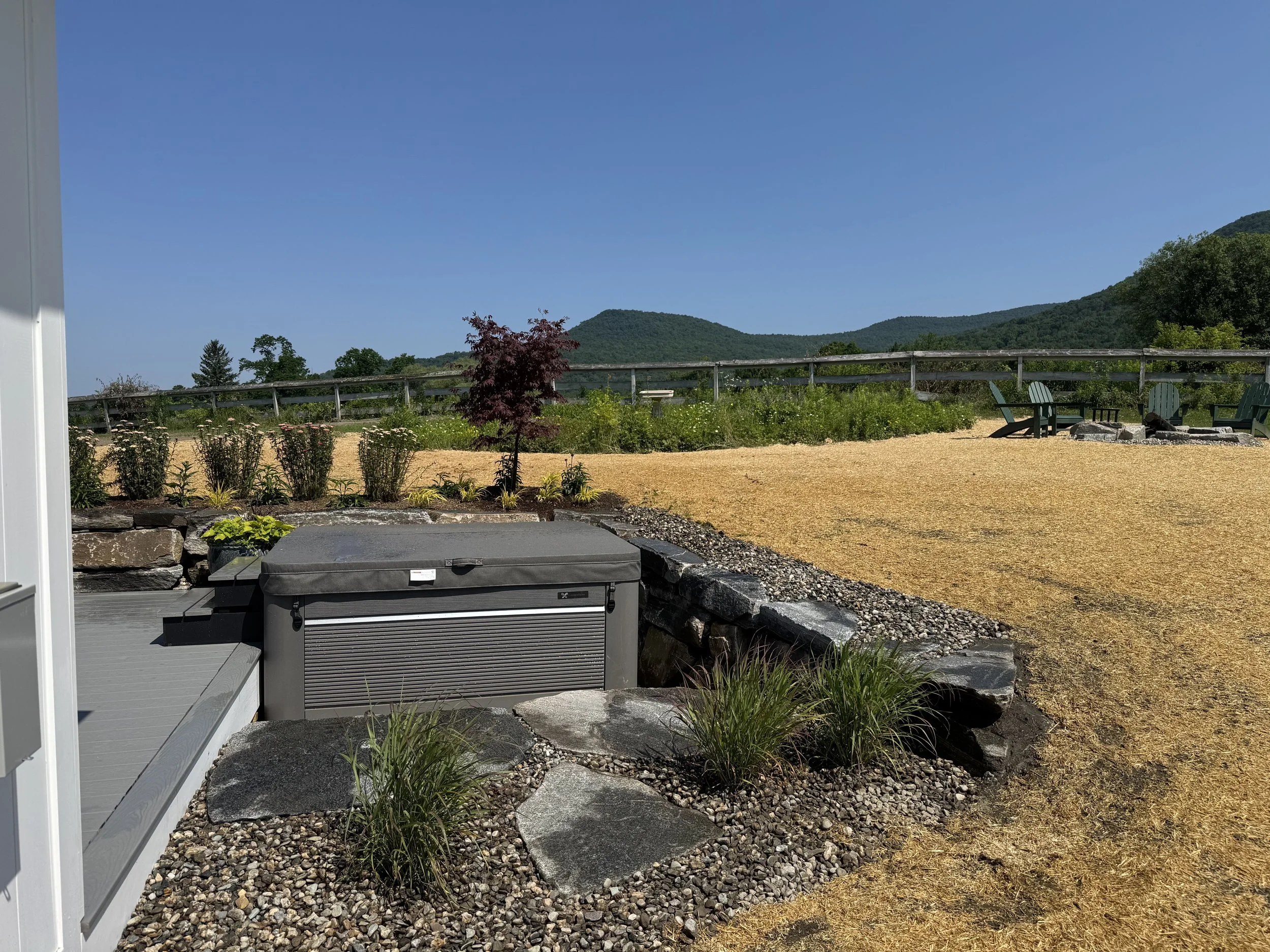 natural stone landscape with hot tub