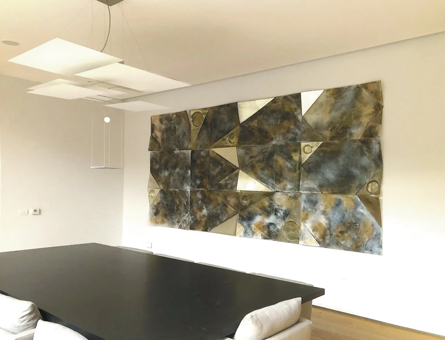 A large-scale floating installation inspired by Japanese paper-folding and Raku ceramics. The multi-layered, glossy surface interacts with light, dynamically revealing its deep colors as the viewer shifts along the wide glass piece.
