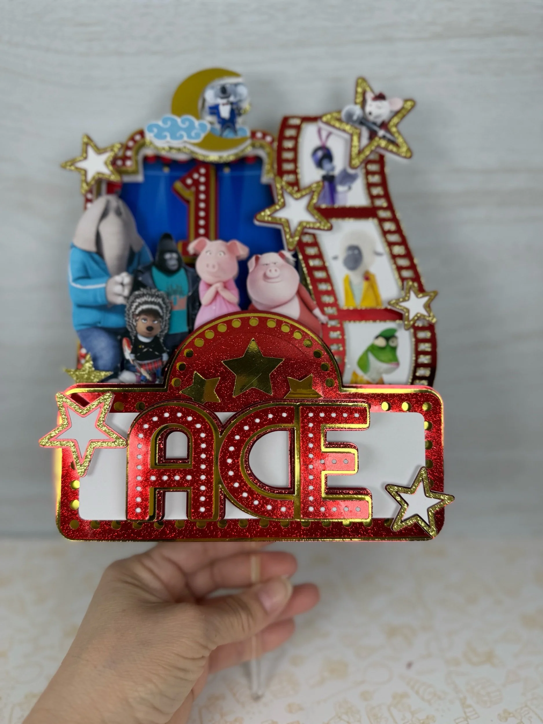 sing the movie cake topper