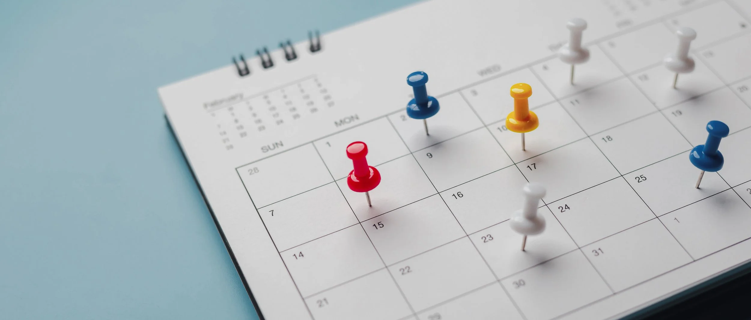 Open diary, pen and reading glasses representing planning the first steps towards a better CRM system.