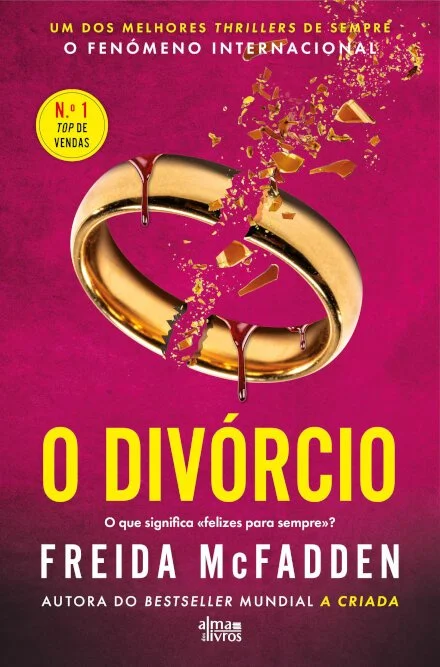 Capa do livro 'O Divórcio' de Freida McFadden, com fundo rosa escuro, título em letras amarelas, uma aliança de casamento dourada quebrada e fragmentada no centro, com detalhes de líquido escorrendo e pedaços de vidro ao redor.