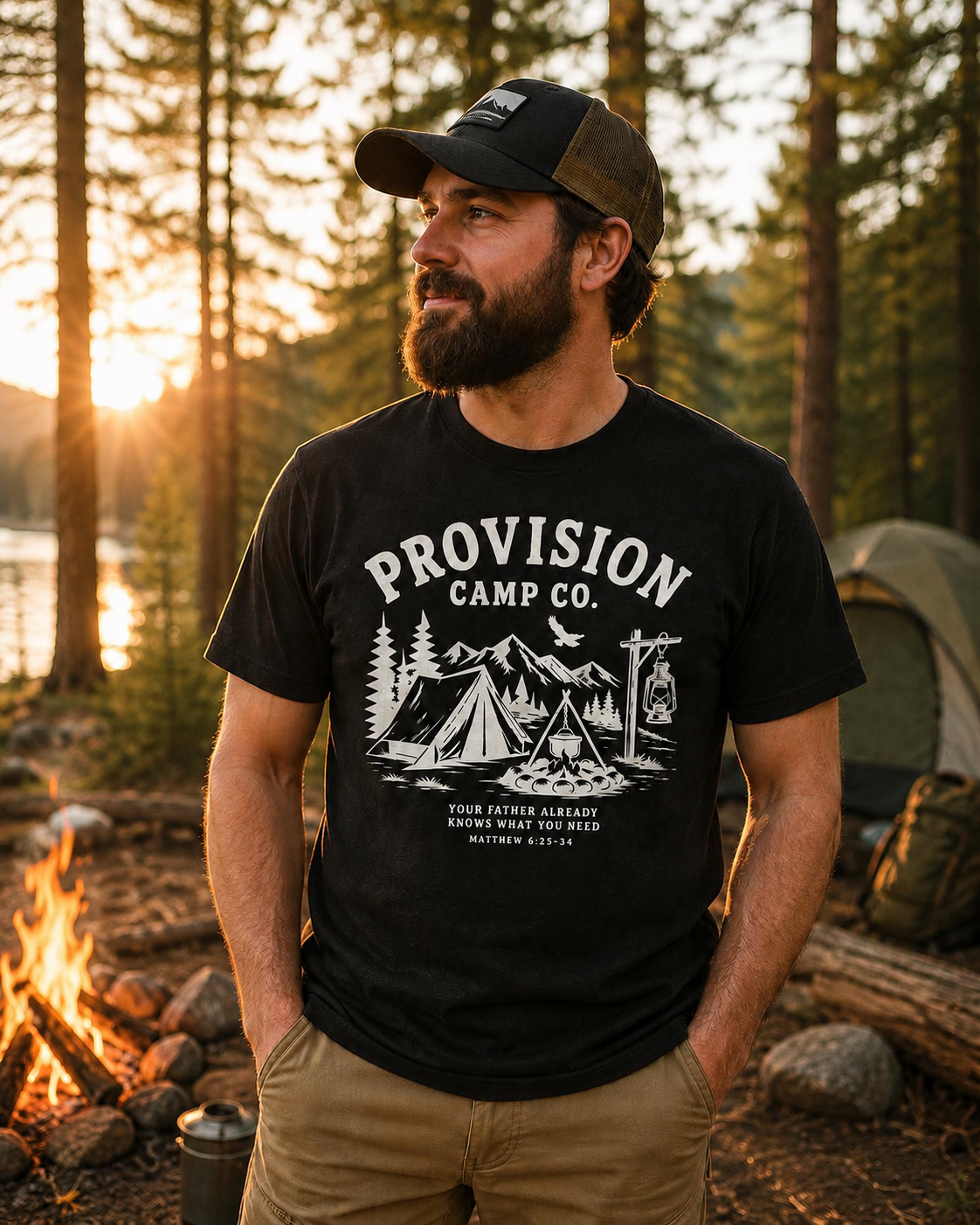 Man wearing the black Provision Camp Co. Christian T-shirt featuring a vintage camping scene design inspired by Matthew 6:25–34.