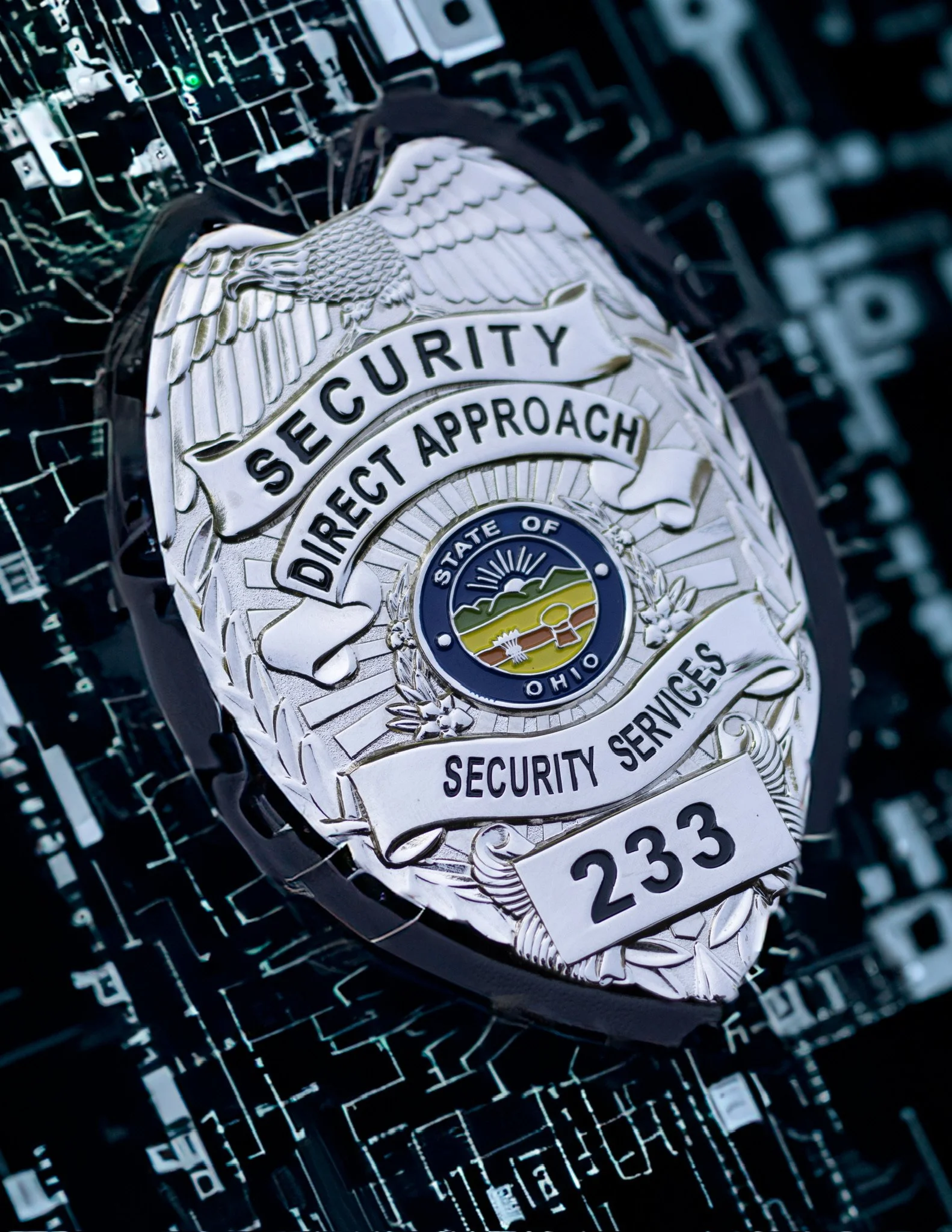 Close-up image of a security badge with an eagle emblem and the text 'Security Director Approach,' against a background of digital circuit board and digital data.