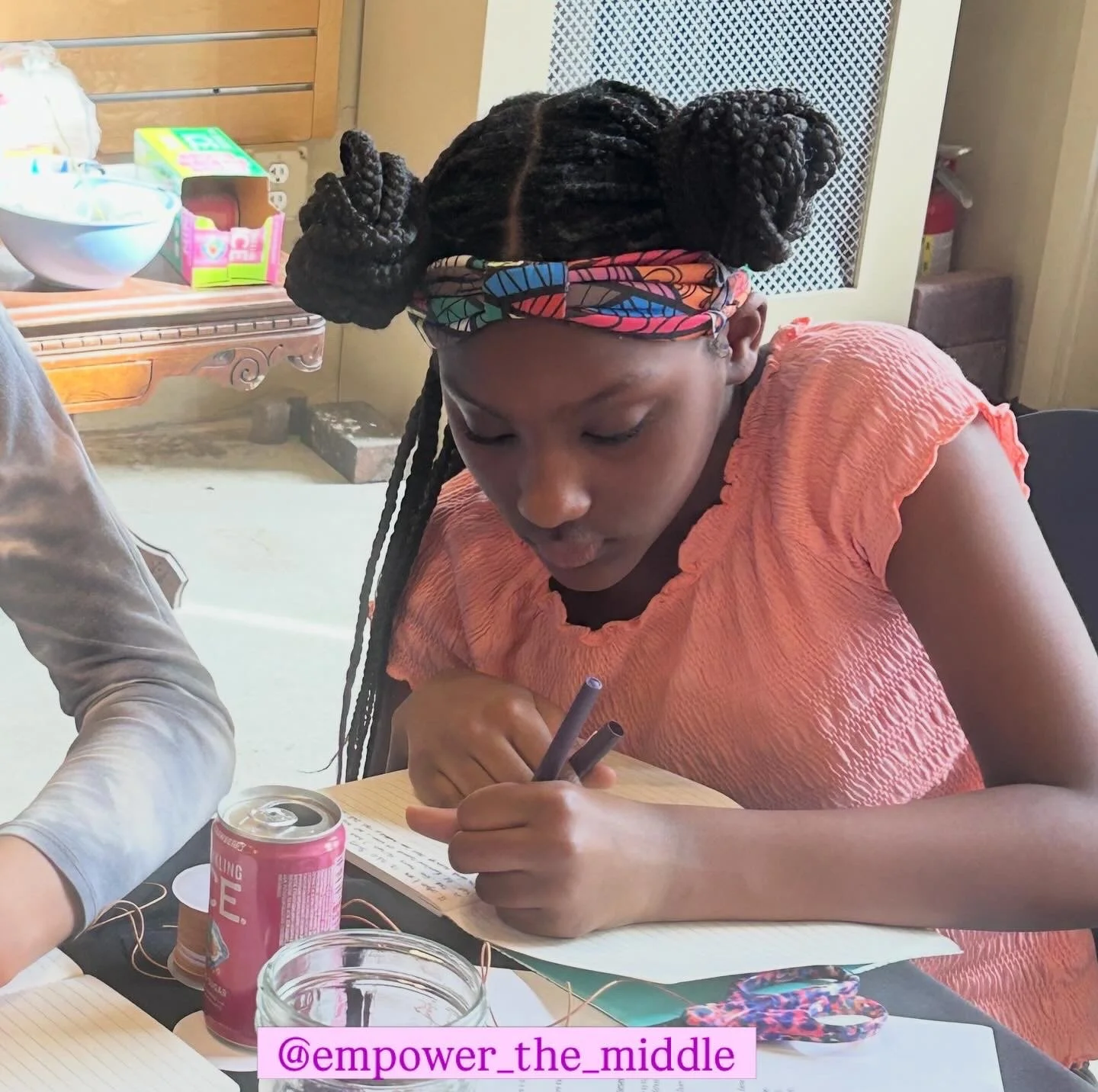 Writing original poetry during March's Girls' Empowerment Poetry Circle. 