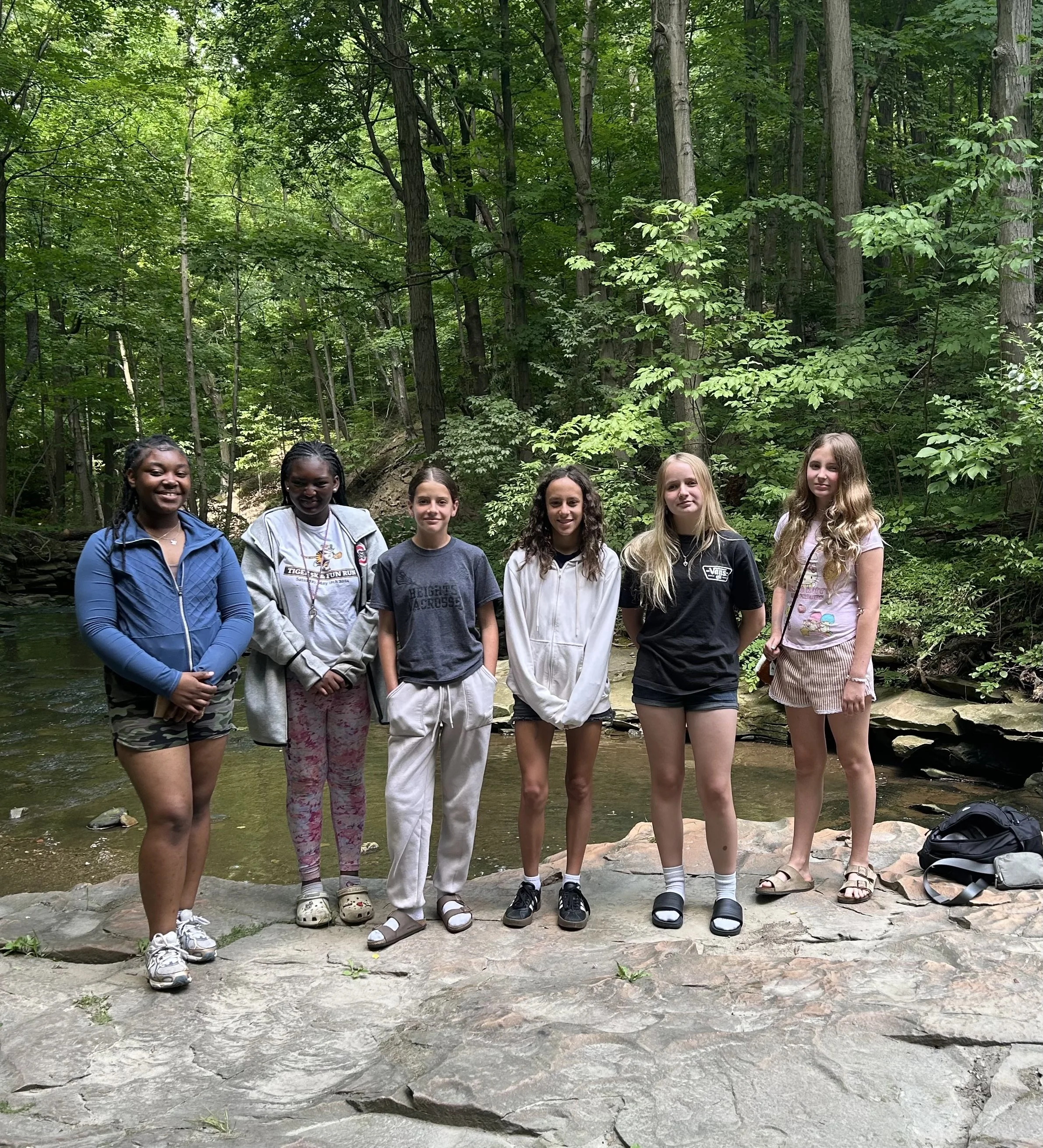 Capturing a moment of confidence with these girls after crossing the creek to find a space to read. 