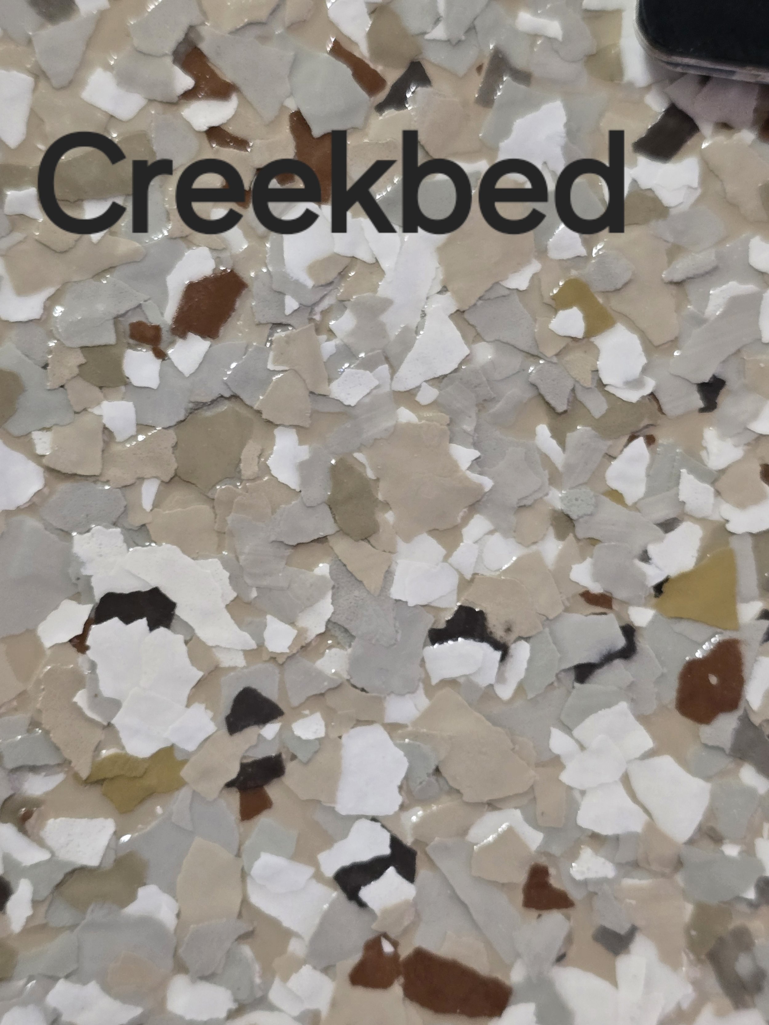Creekbed colored vinyl flakes