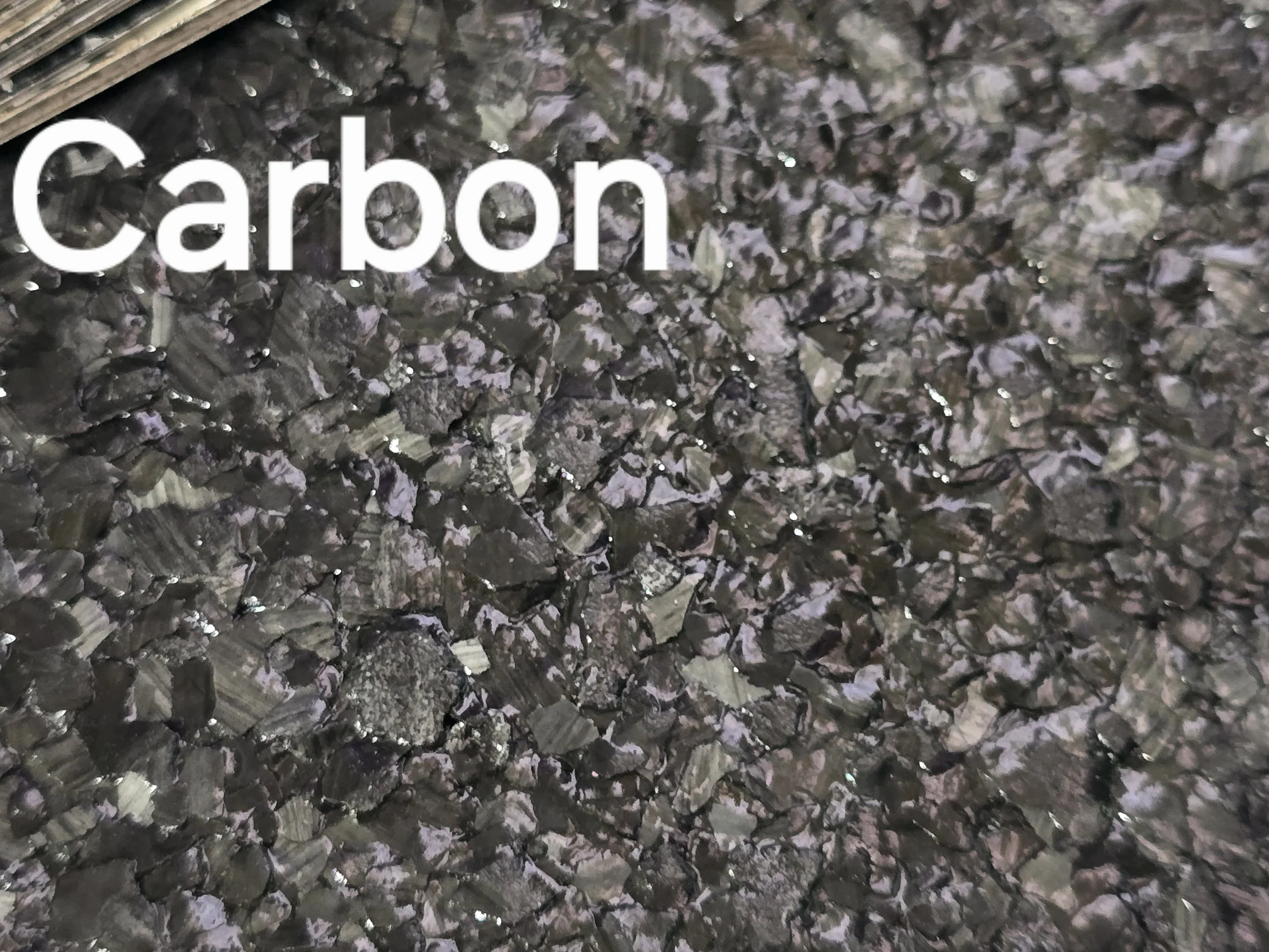 Carbon colored vinyl flakes