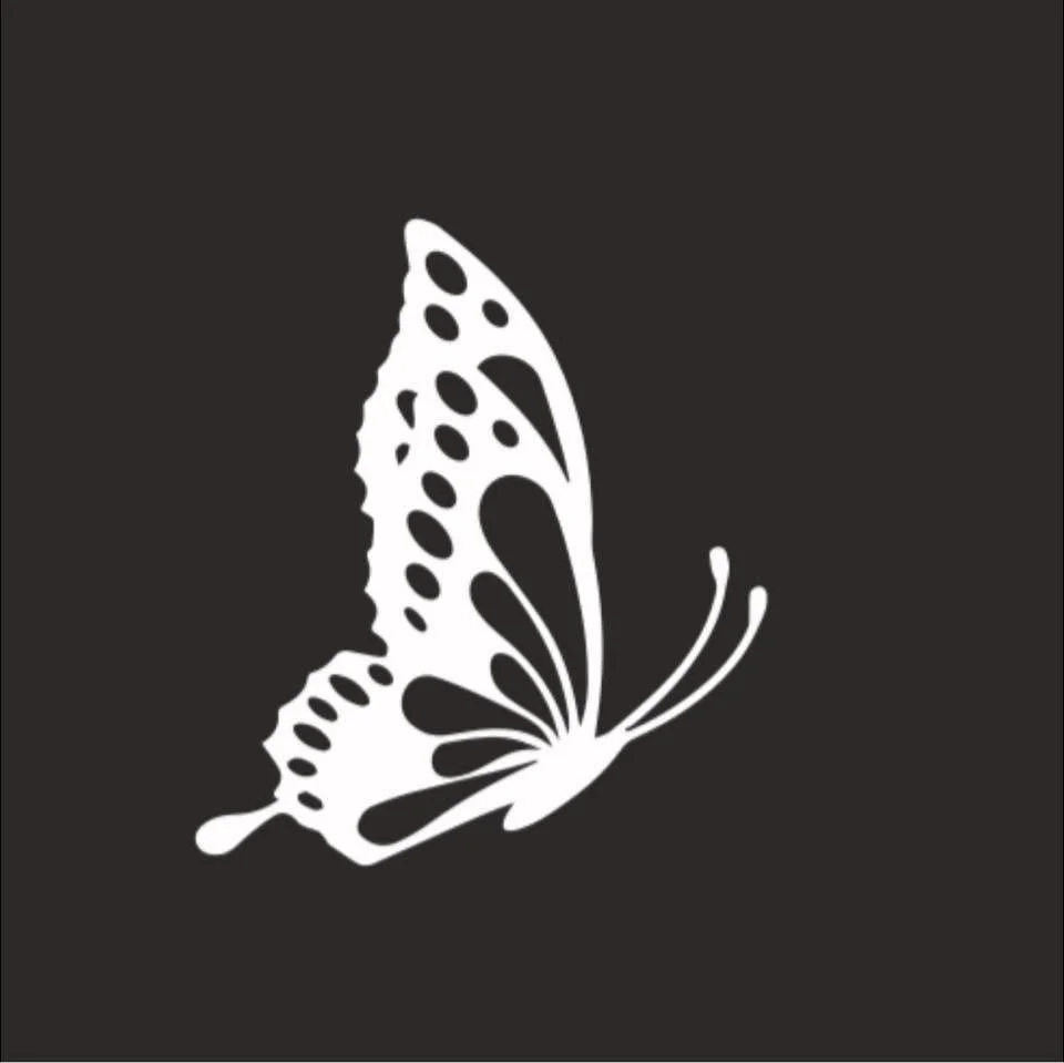 A white butterfly silhouette on a black background.