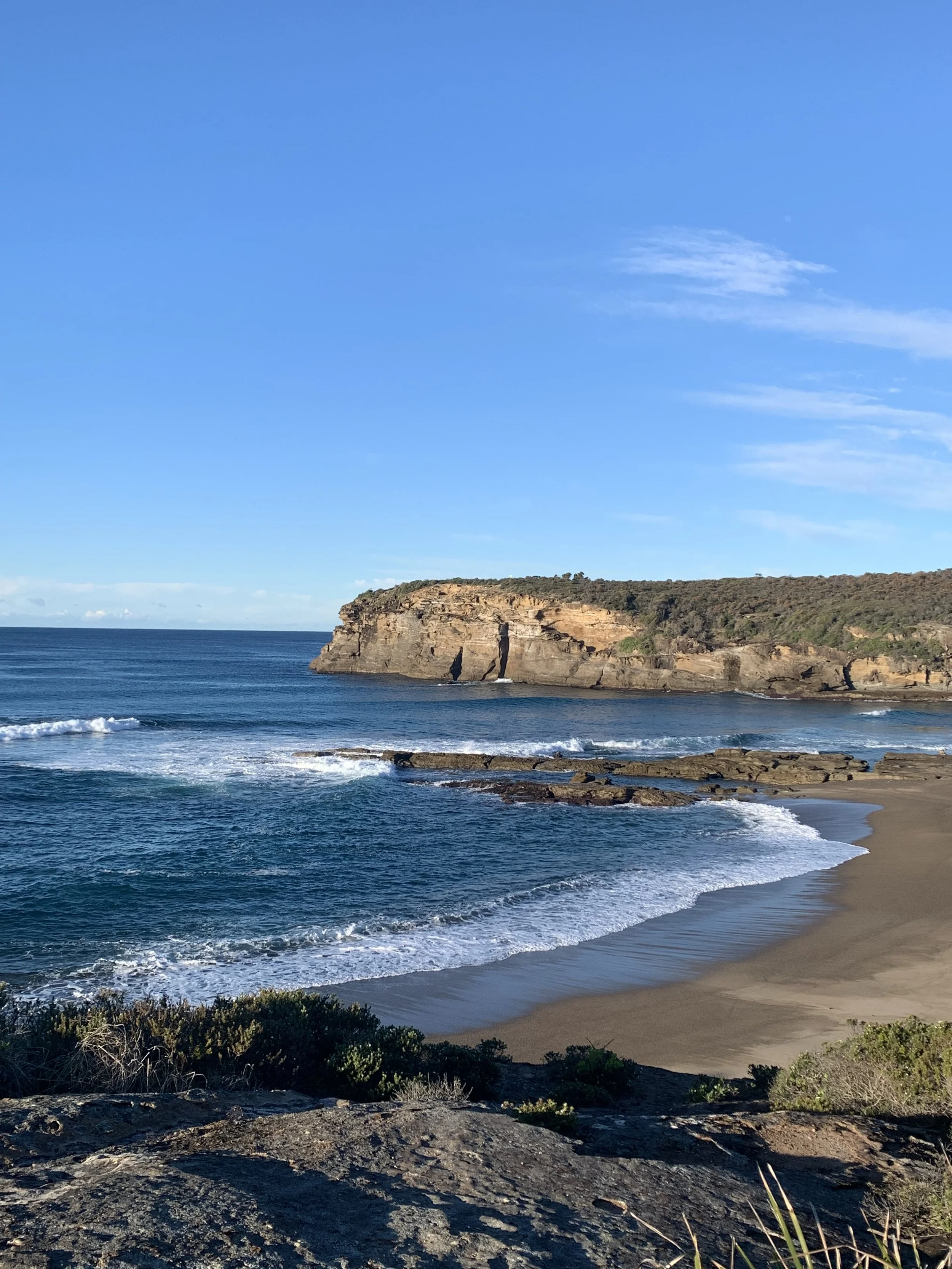 The coastline south of Shark Hole, rock platform and headland above the ocean