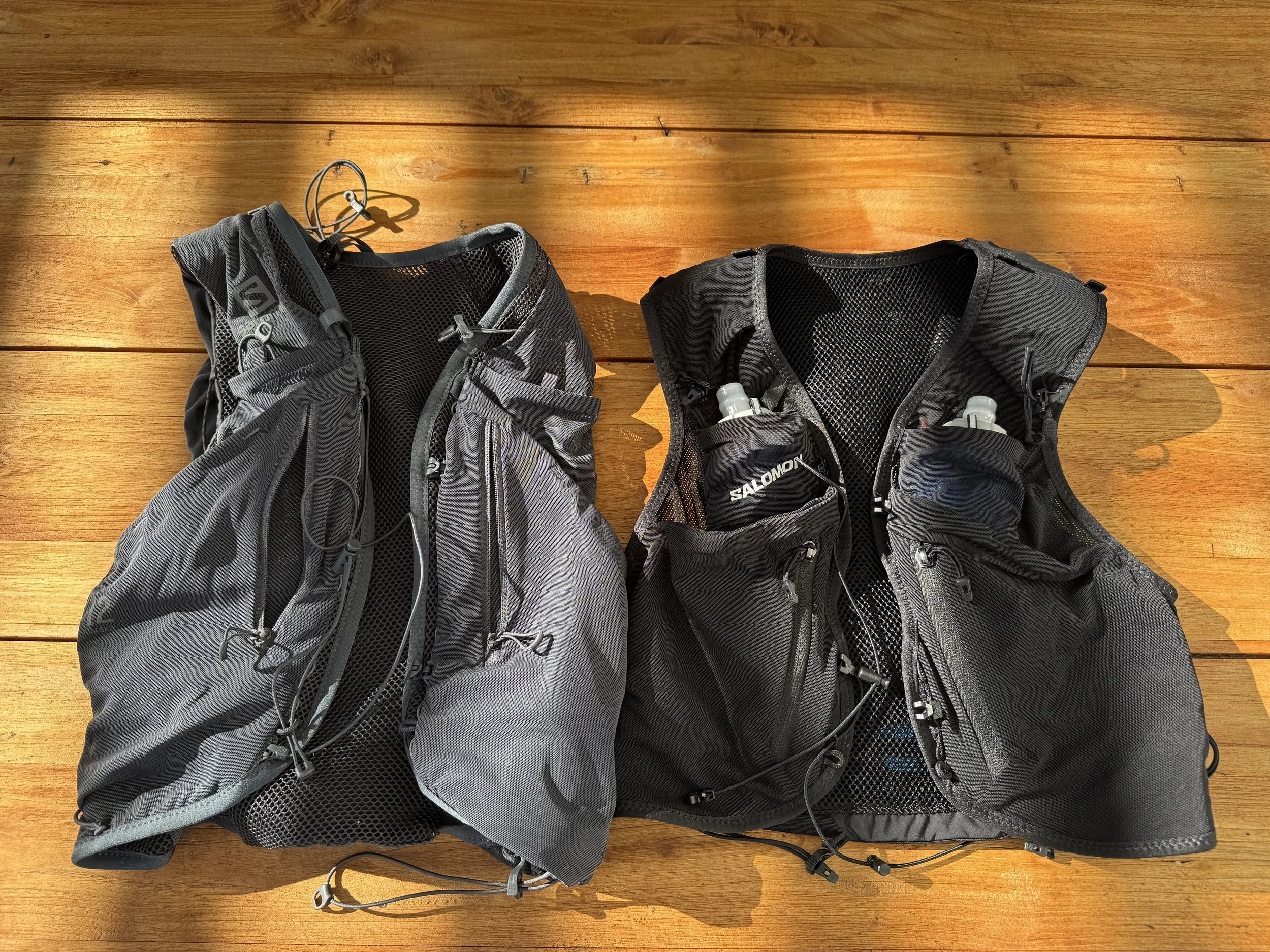 Old unisex vest beside the new women's cut, front on