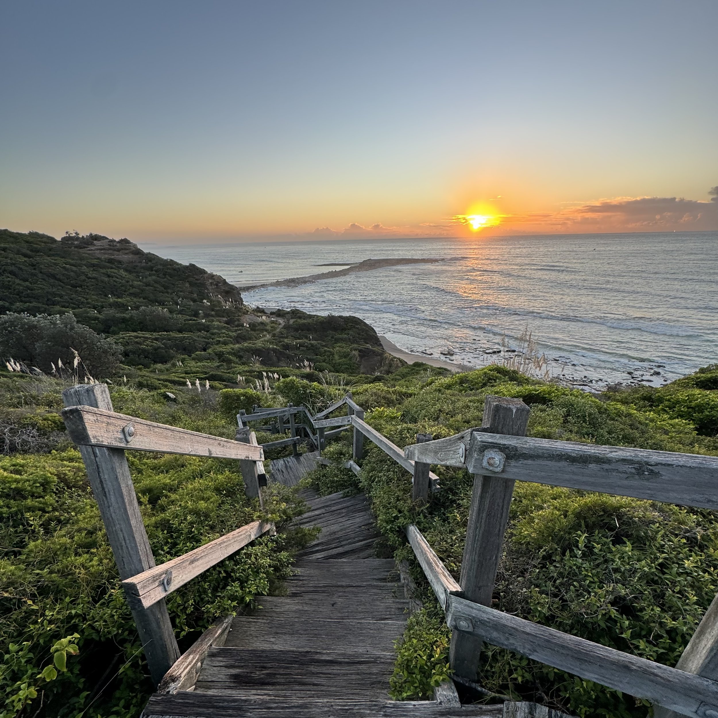 Boardwalk steps down to the beach