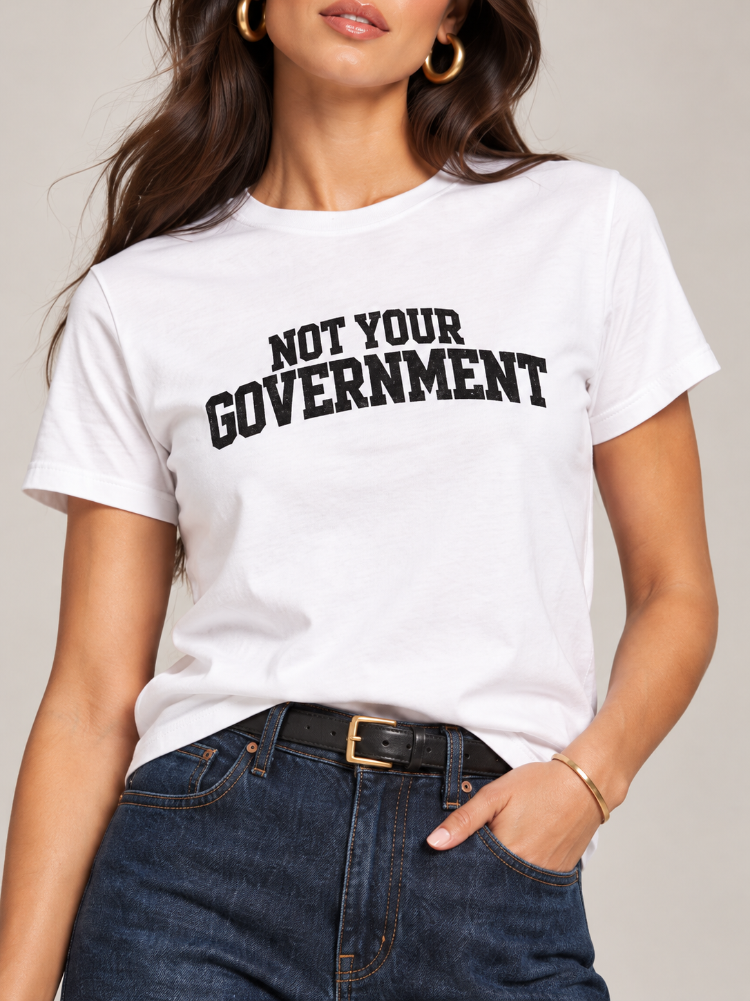 White graphic tee with belt and denim.png