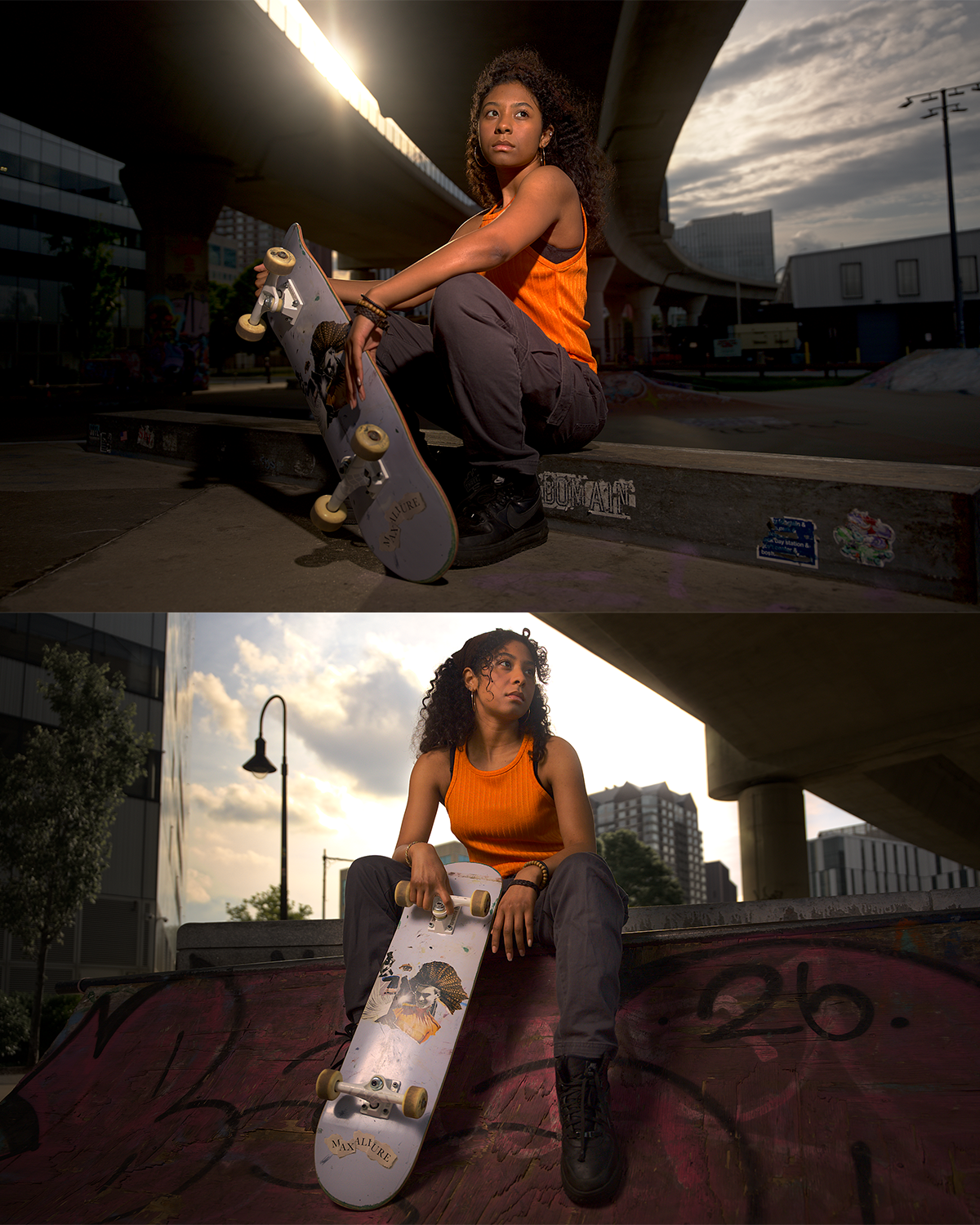 A young woman with curly hair, wearing an orange sleeveless top and dark pants, sitting on a skate ramp outdoors under a bridge during sunset, holding a skateboard. The setting features urban buildings, graffiti, and a cloudy sky.
