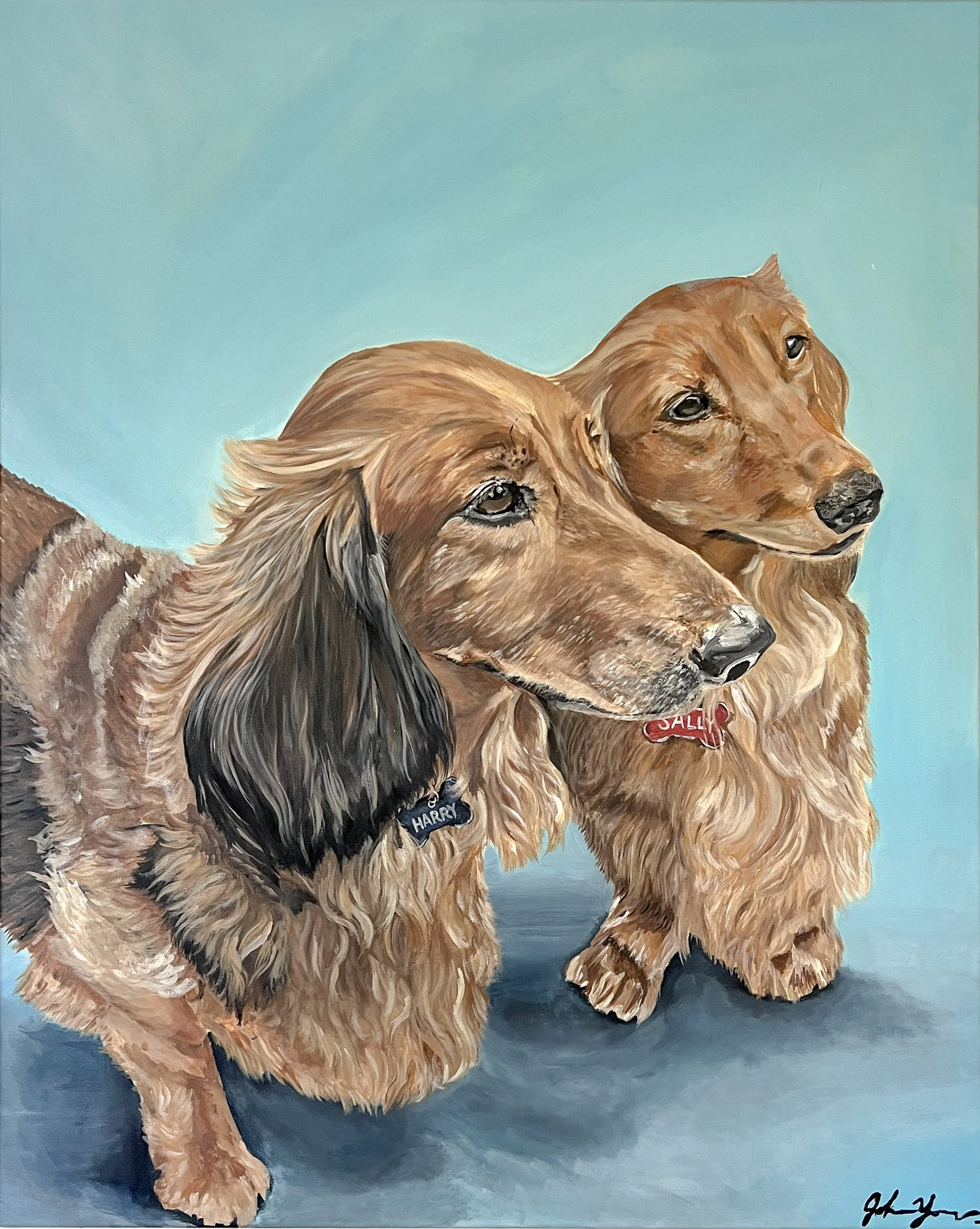 A painting of two dogs, a golden retriever and a black and tan long-haired dog, sitting together against a blue background. The dogs have shiny coats and are wearing name tags.