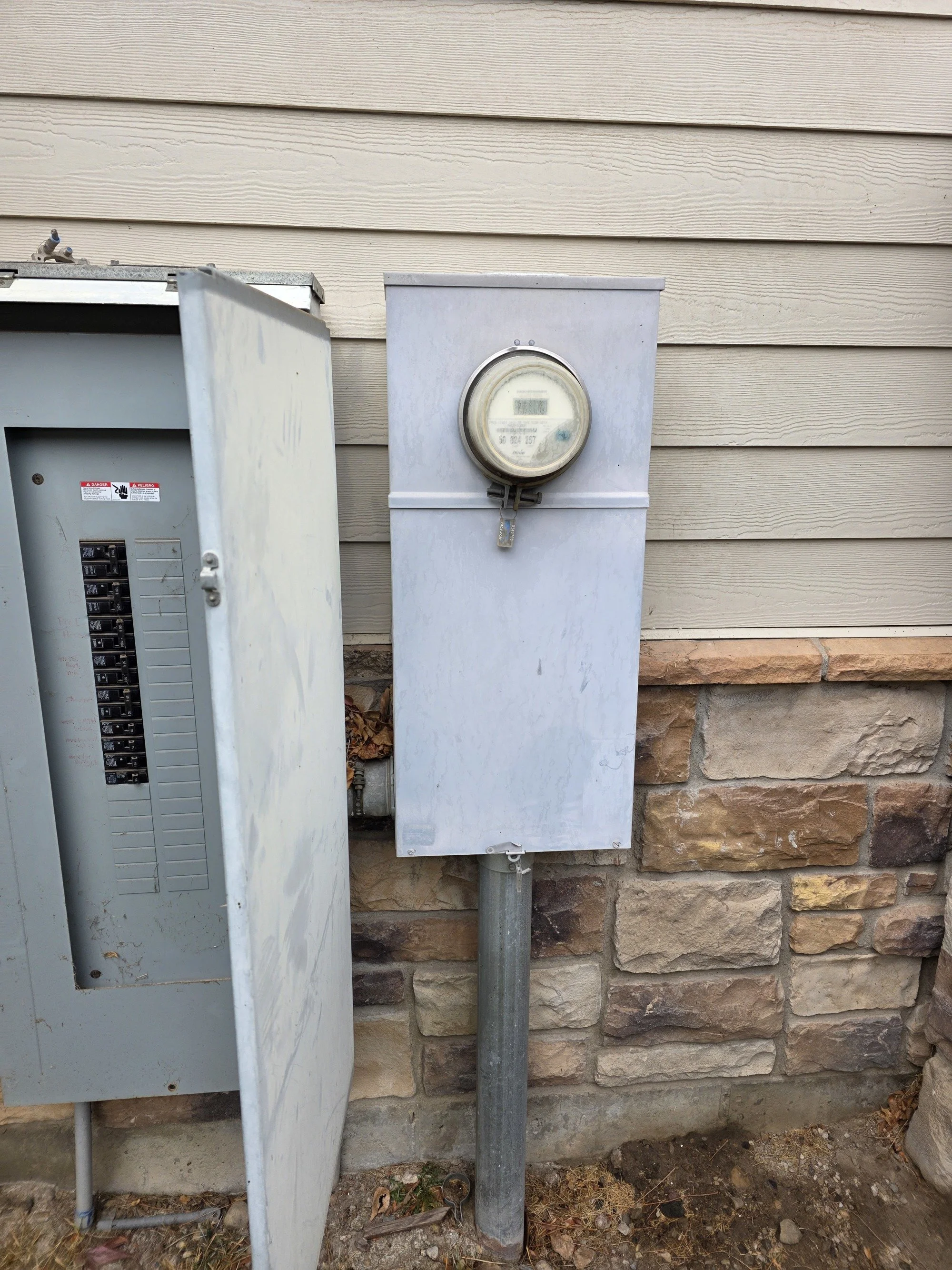 Exterior residential electrical panel and meter installation by Rentmeister Electric in Northern Utah.
