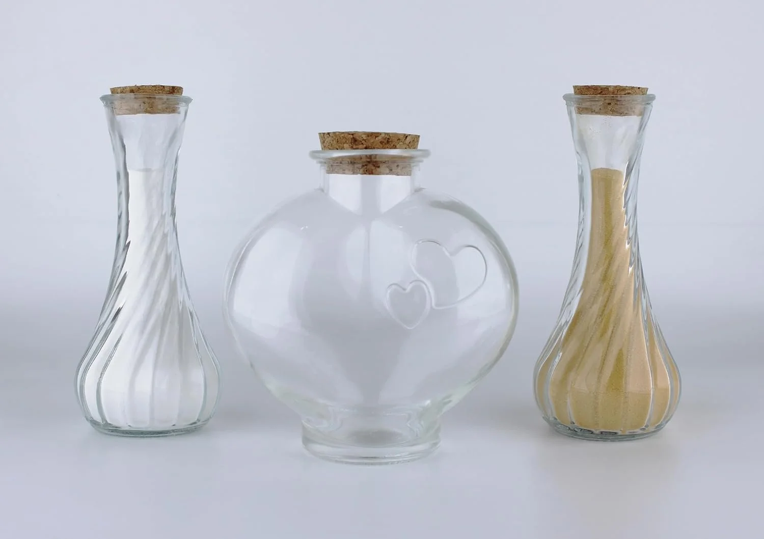 Heart shape glass jar with two pouring jars for sand ceremony for wedding.