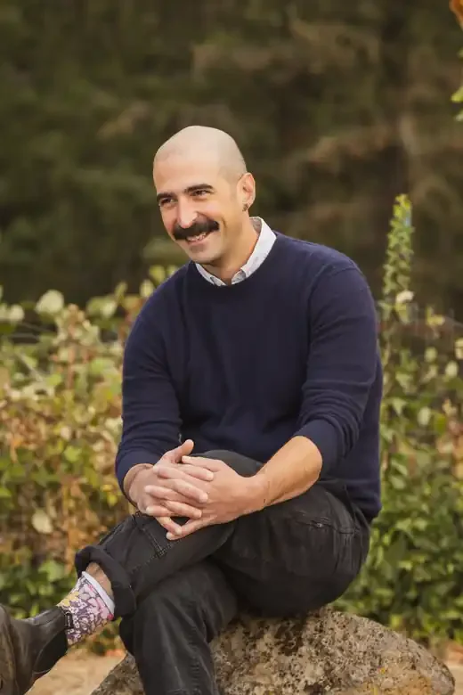 Jon LaBella, LMFTA, therapist at Gorge Therapy Group, sitting outdoors in White Salmon, WA