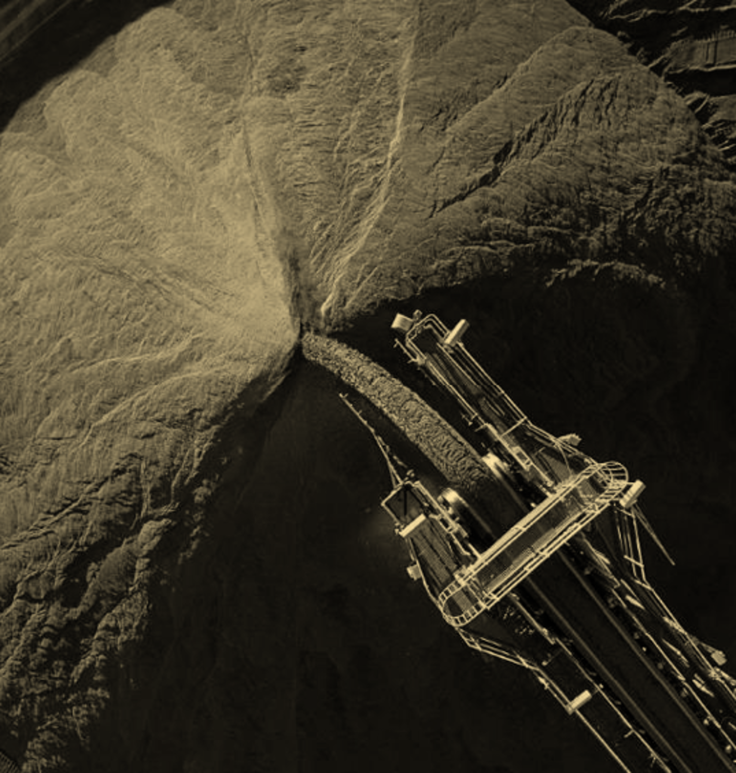 An aerial view of a mining stacker loading ore to the stockpile. the operators who would use this are all fully trained, competent and compliant to their role requirements.