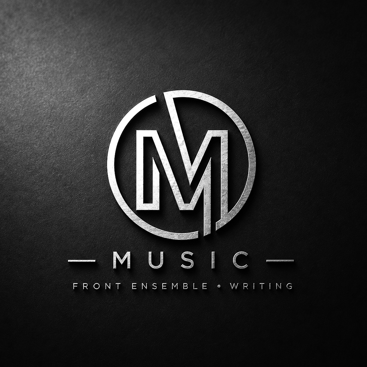 Silver and black logo with the initials M and V inside a circle, with the words MUSIC, FRONT ENSEMBLE, and WRITING below.