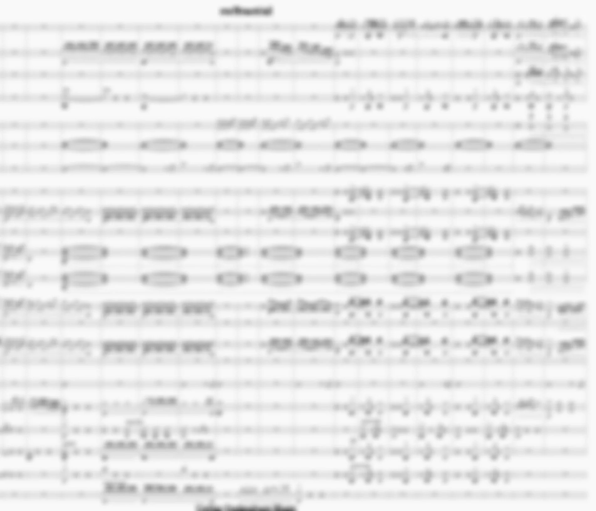 Blurred image of sheet music with musical notes and staff lines.
