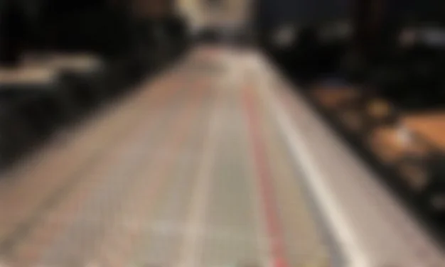 A blurred image of a mixing board.