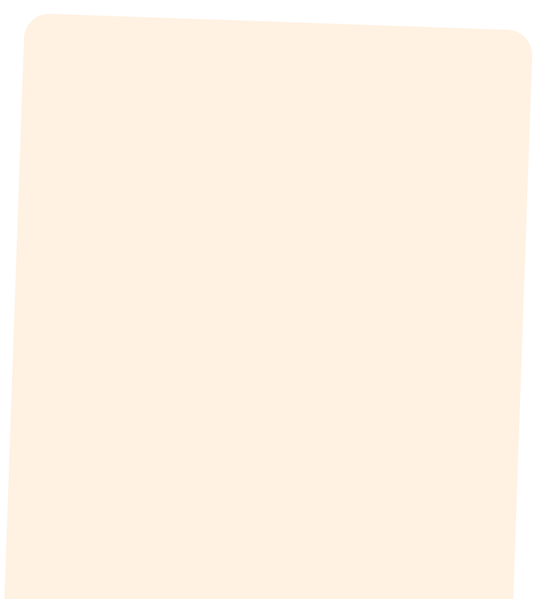 A close-up view of a beige-colored surface with rounded edges, possibly the corner of a fabric or paper item.