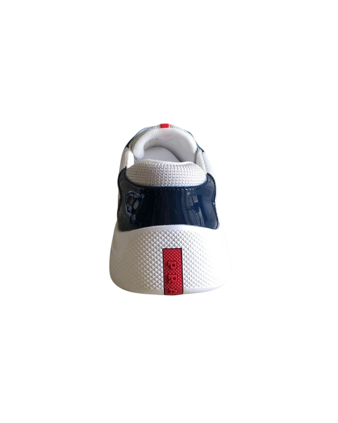 Front and heel view of the navy Prada America's Cup sneaker showing the red heel tab