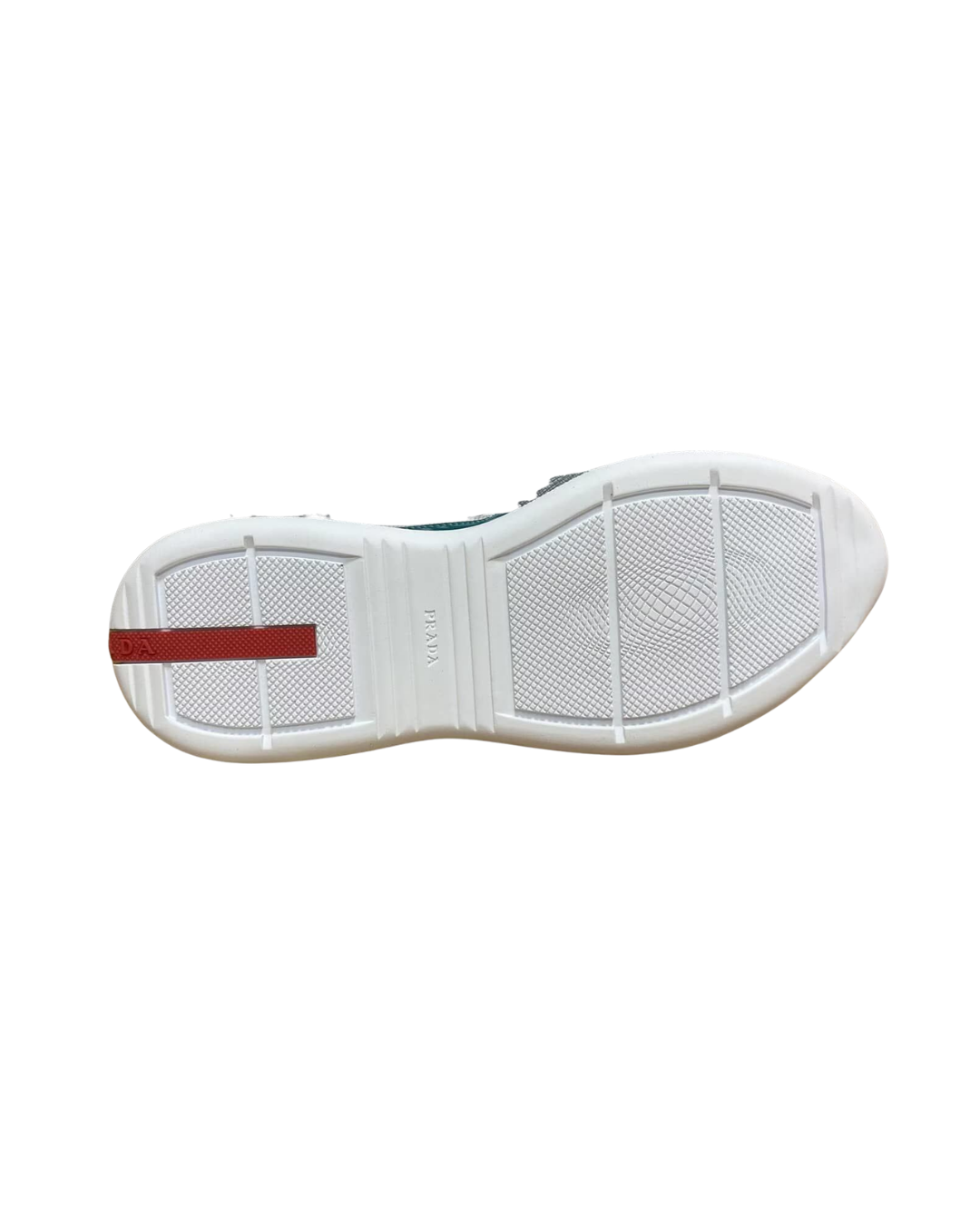 Outsole view of the Prada America's Cup Lagoon Blue trainer showing the white sole with red stripe