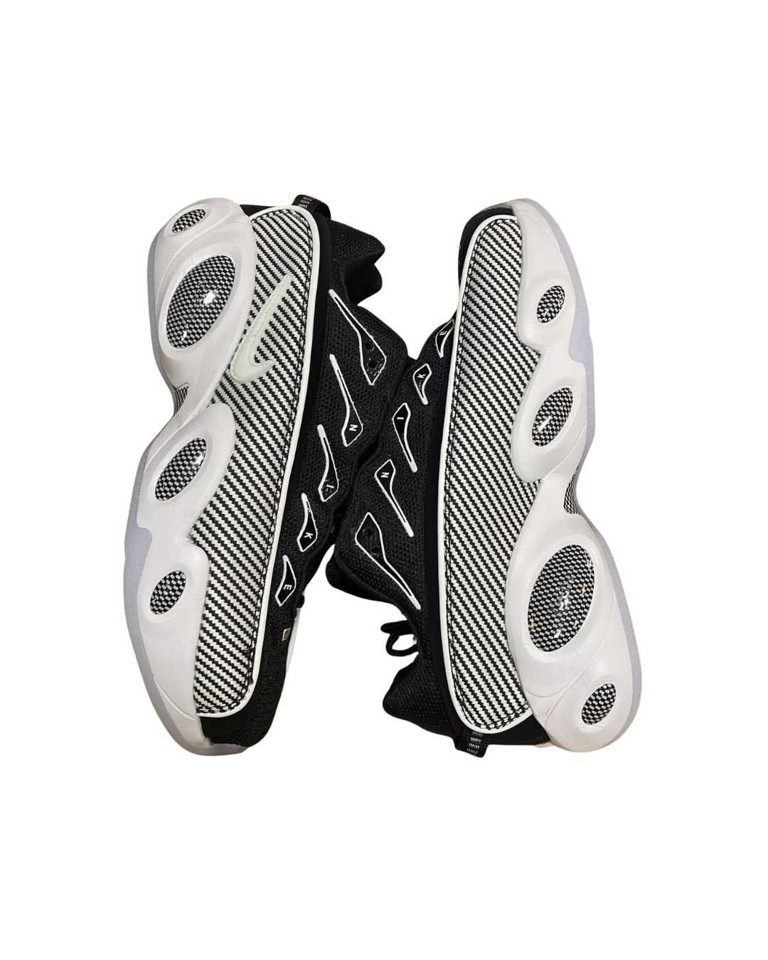 Angled top view of a pair of Nike NOCTA Glide Drake sneakers