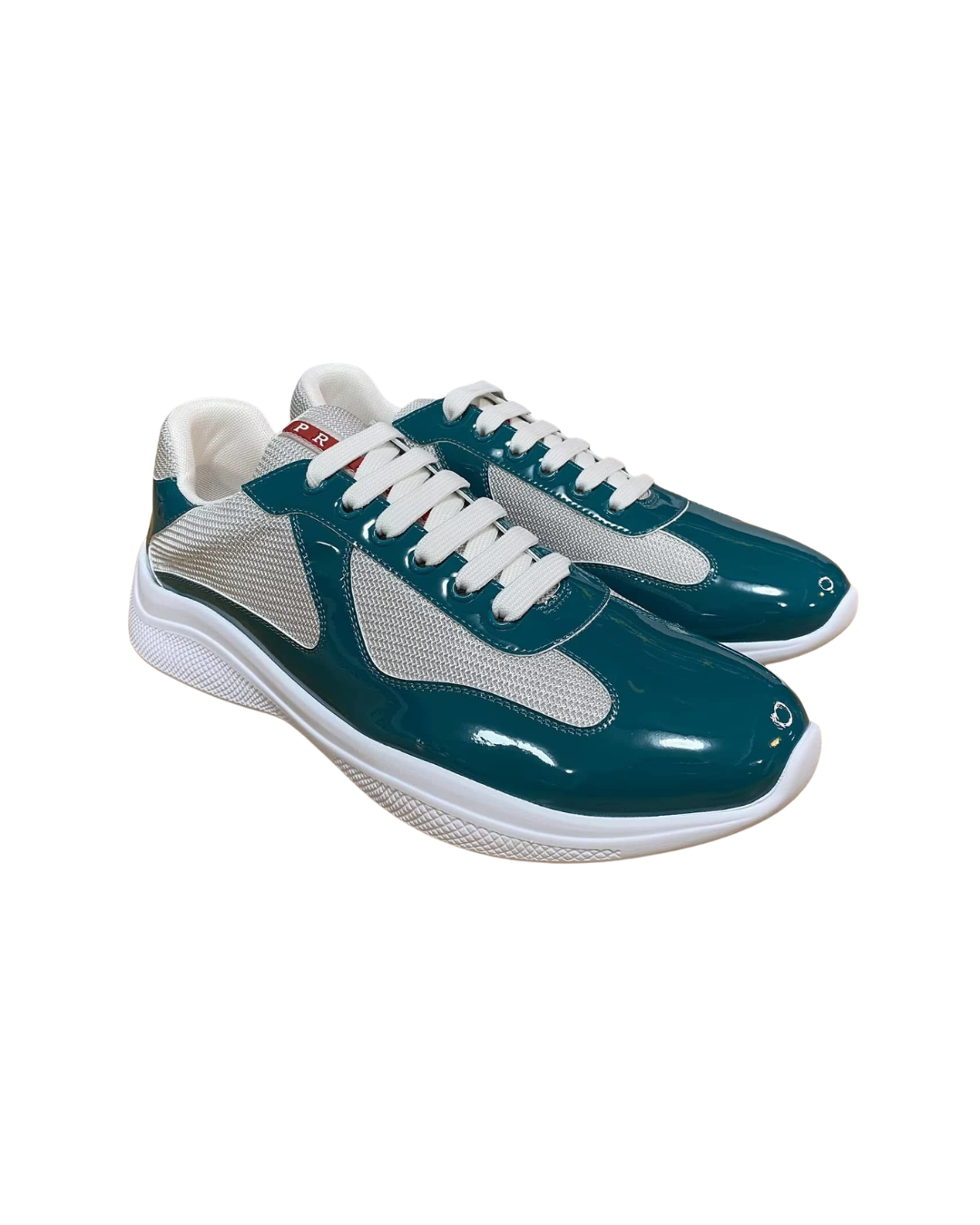 Three-quarter angled view of the Prada America's Cup Lagoon Blue trainer in teal