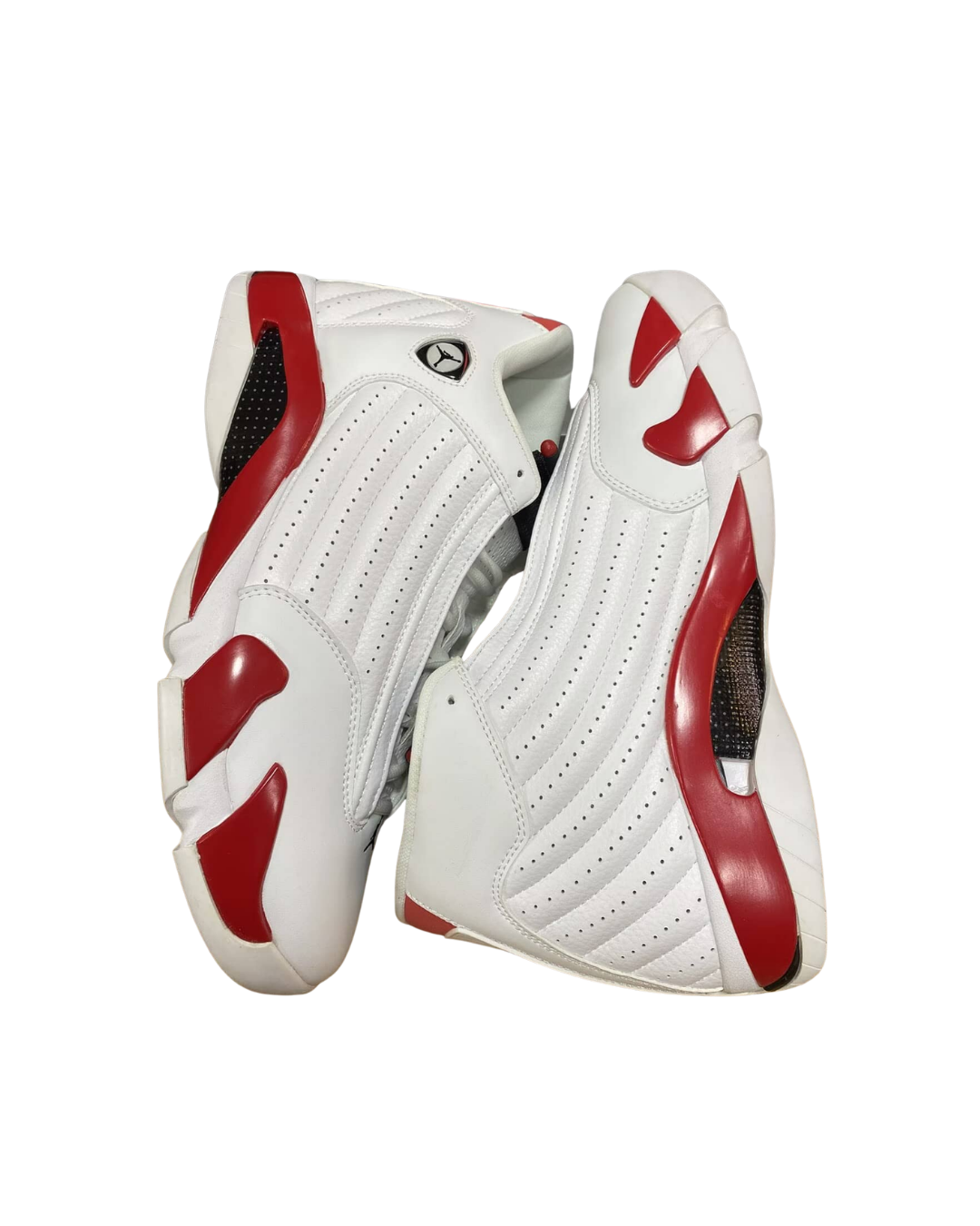 Side angled view of a pair of Air Jordan 14 Retro Candy Cane sneakers leaning together