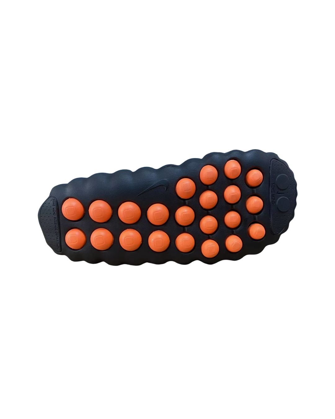 Outsole view of the Nike Mind 001 mule showing the orange sensory node bumps