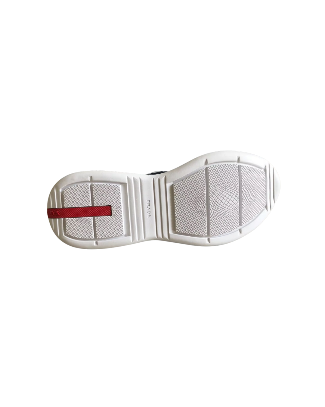 Outsole view of the Prada America's Cup sneaker showing the white sole with red stripe detail