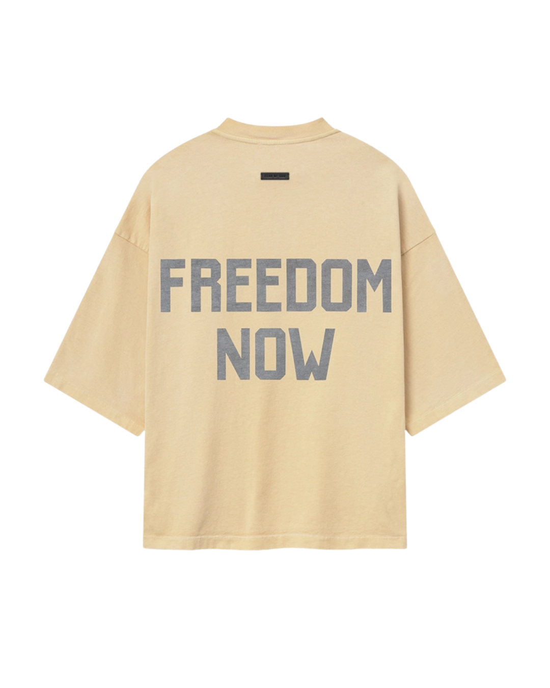 Back view of the tan Fear of God tee with a FREEDOM NOW print