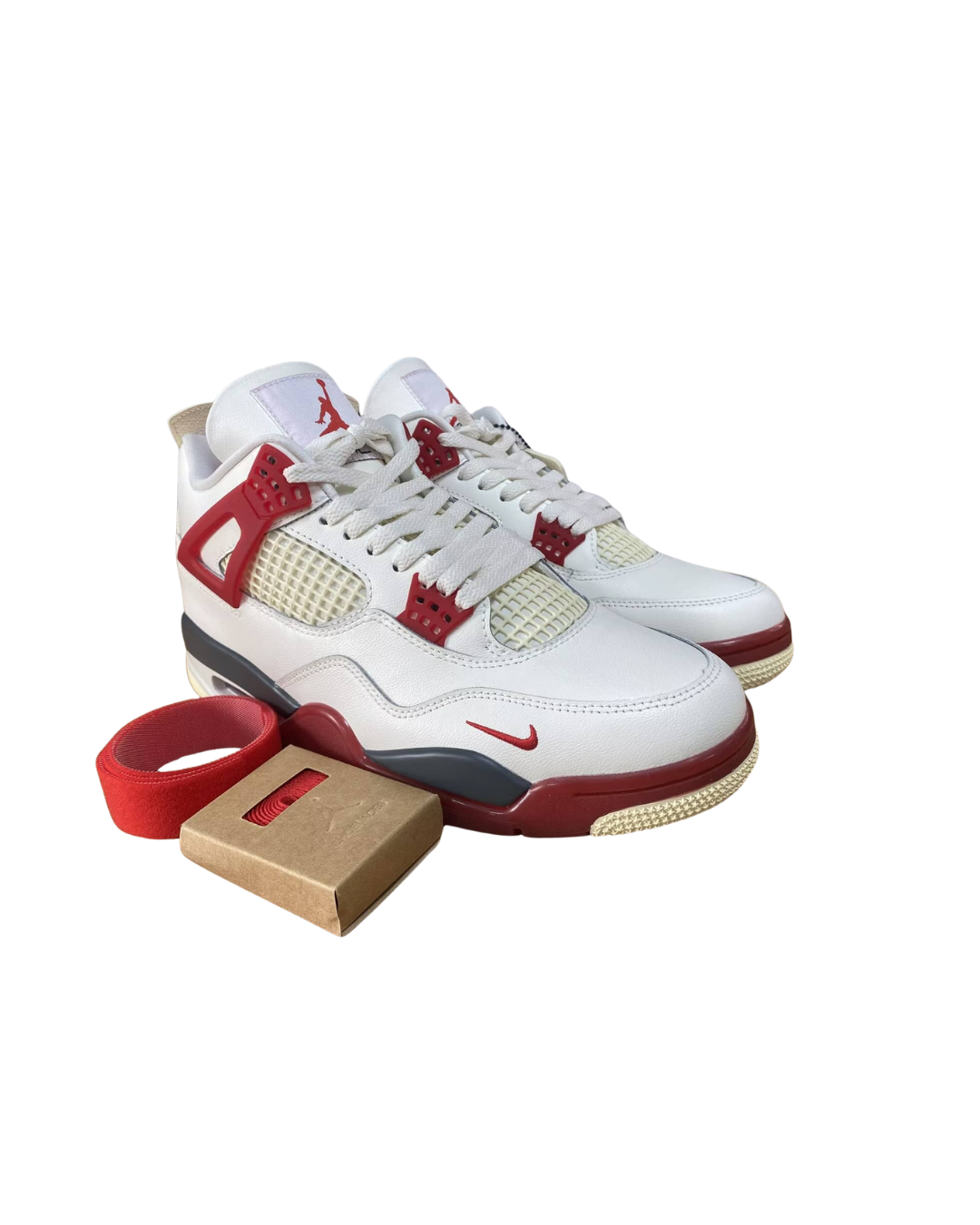 Nigel Sylvester x Air Jordan 4 Brick After Brick pair displayed with the shoebox