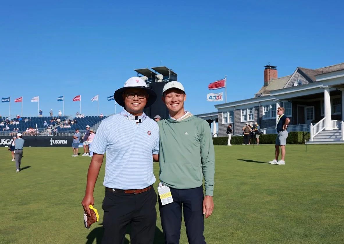 Robert Lee standing next to PGA Tour Agent Danny Oh on the ninth hole at Shinnecock Hills Golf Club, inside the ropes, during a Wednesday practice round at the 2026 US Open. Robert was inside the ropes with PGA Tour Players Dylan Wu and Ludvig Aberg.