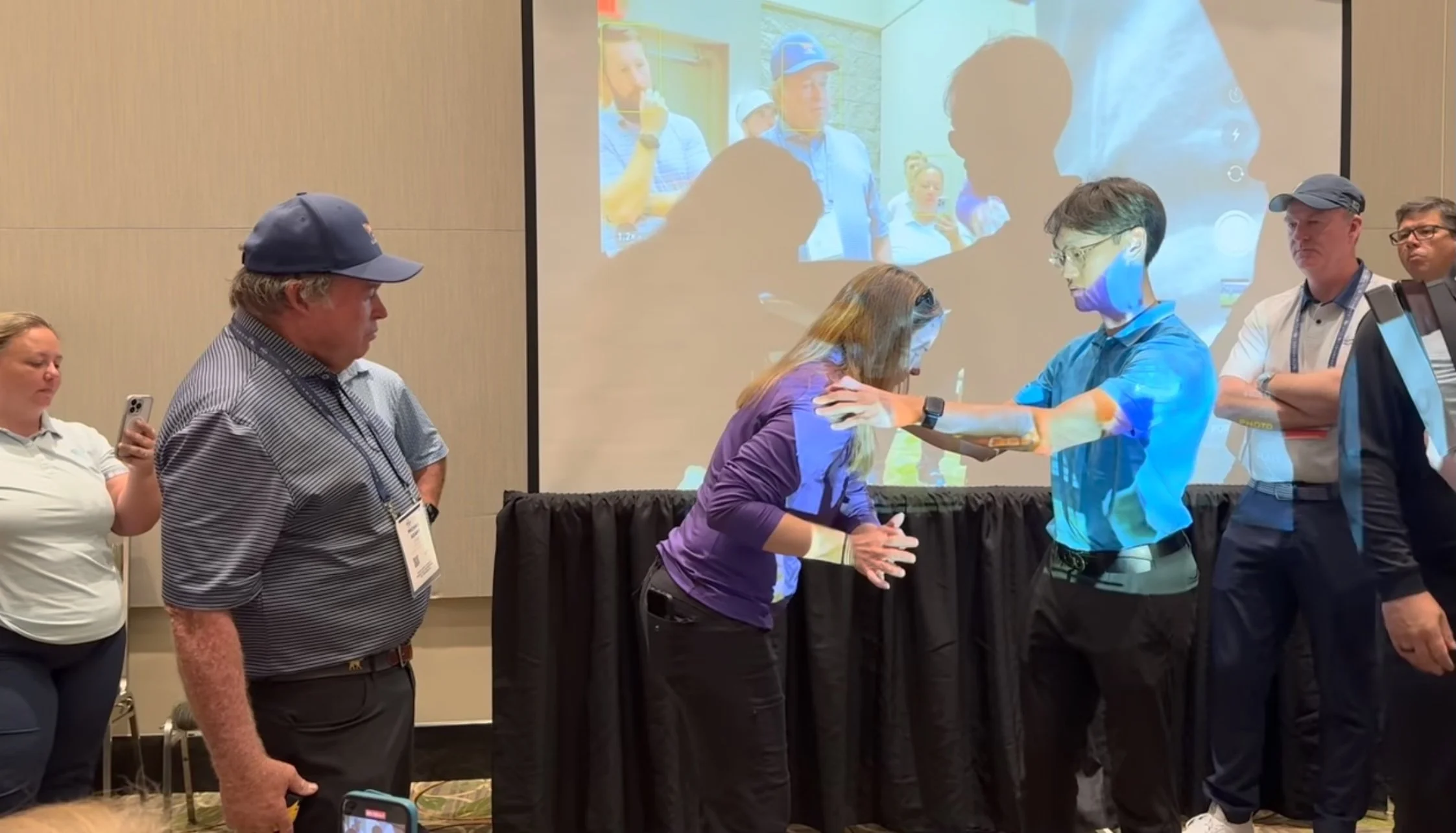 Robert Lee using an Ultimate Golf Lesson Assessment tool to assess a PGA pro at a seminar hosted by Mike Adams and Terry Rowles during the 2024 PGA Show