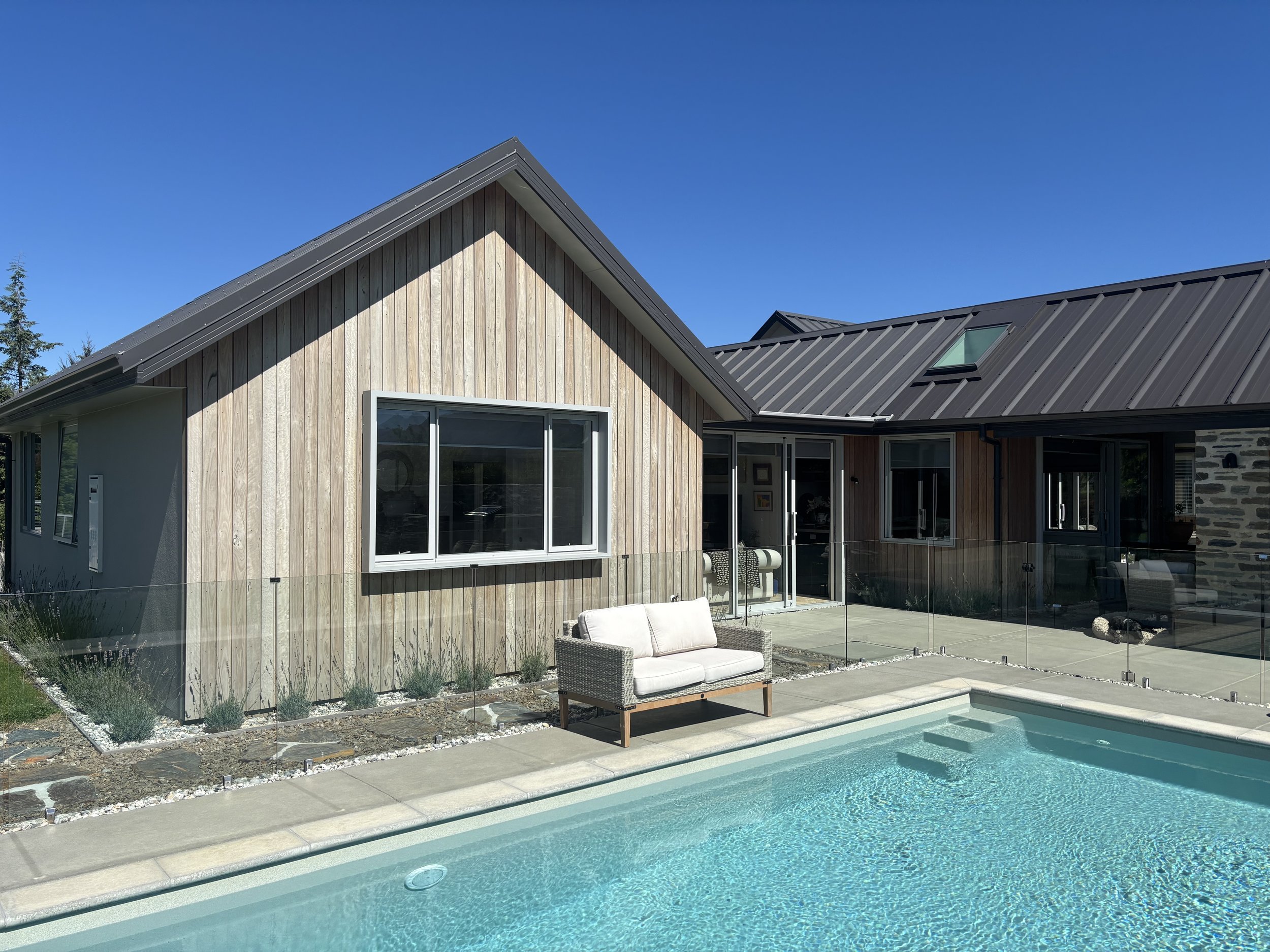 Naturally weathered IRONCLAD hardwood timber cladding on a New Zealand home
