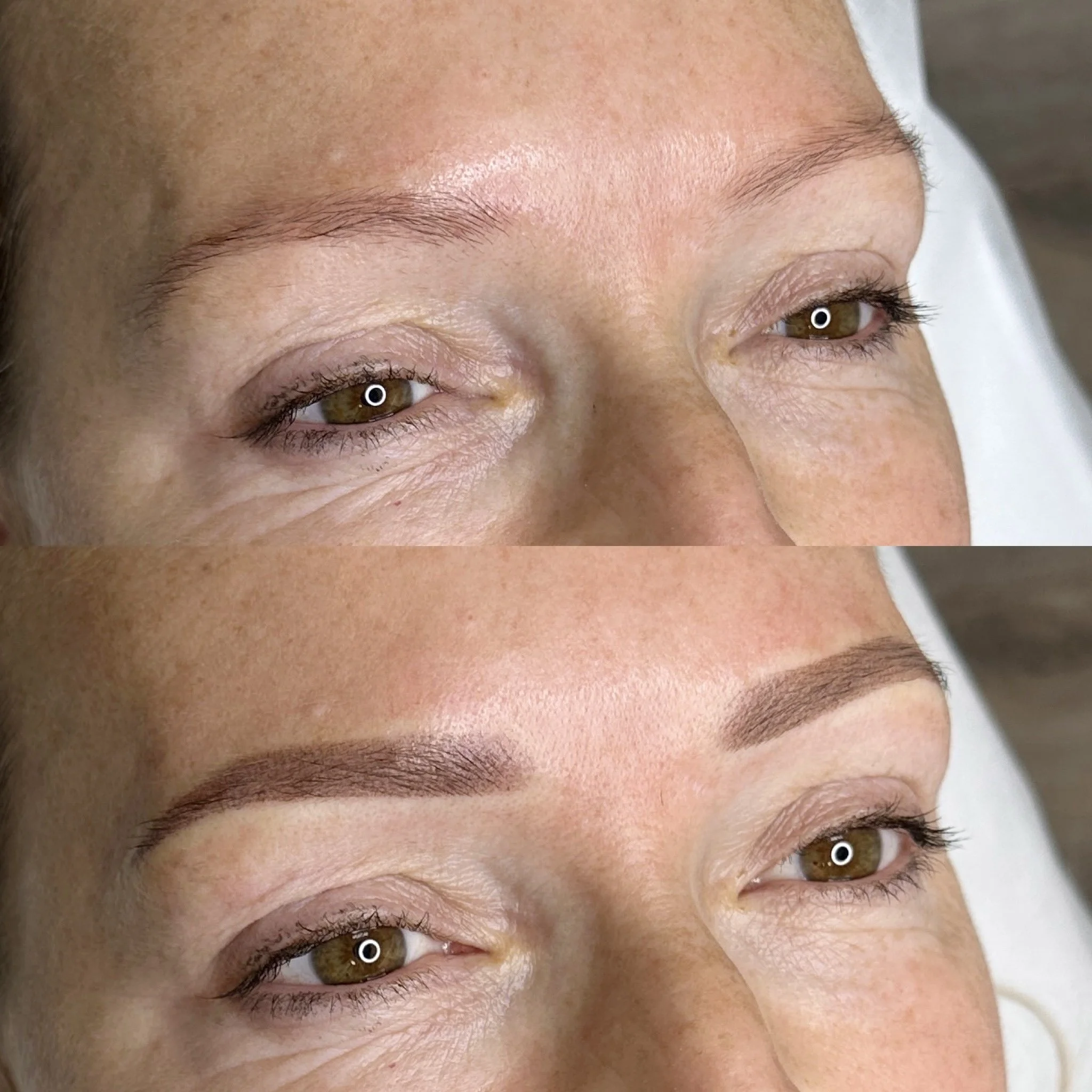 Close-up of a person's forehead and eyes, showing well-groomed eyebrows, light skin, and brown eyes with makeup, captured from an angle.