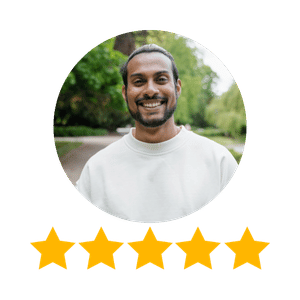 A smiling man with a beard and white shirt outdoors, five-star rating below.