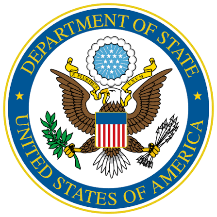 The seal of the U.S. Department of State featuring an eagle holding an olive branch and arrows, with a shield on its chest and a circle of stars above its head, encircled by a blue border with gold text.