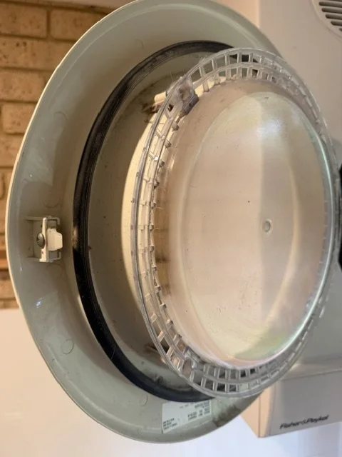 Washing machine drum door before cleaning