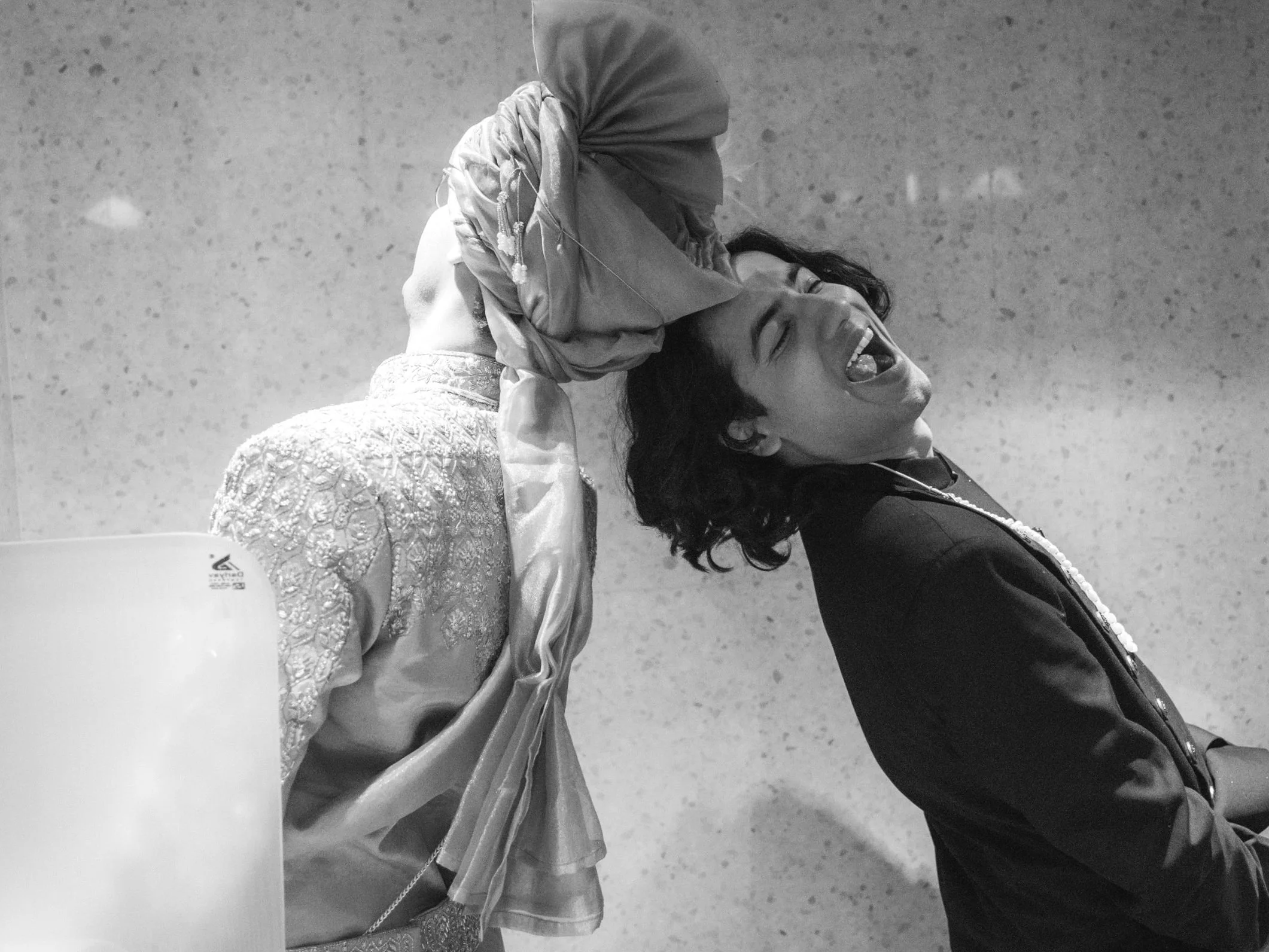 this is a very intimate moment captured where groom and his bestfriend is taing a leak