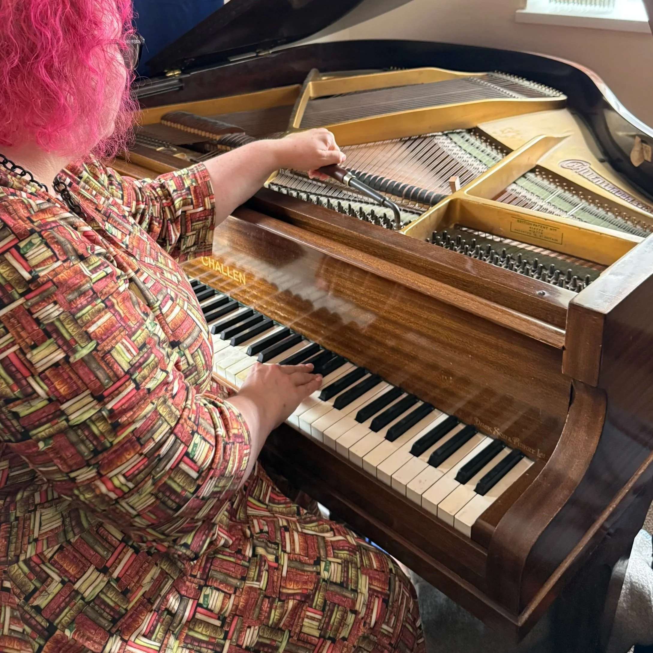 Abi tuning a Challen baby grand