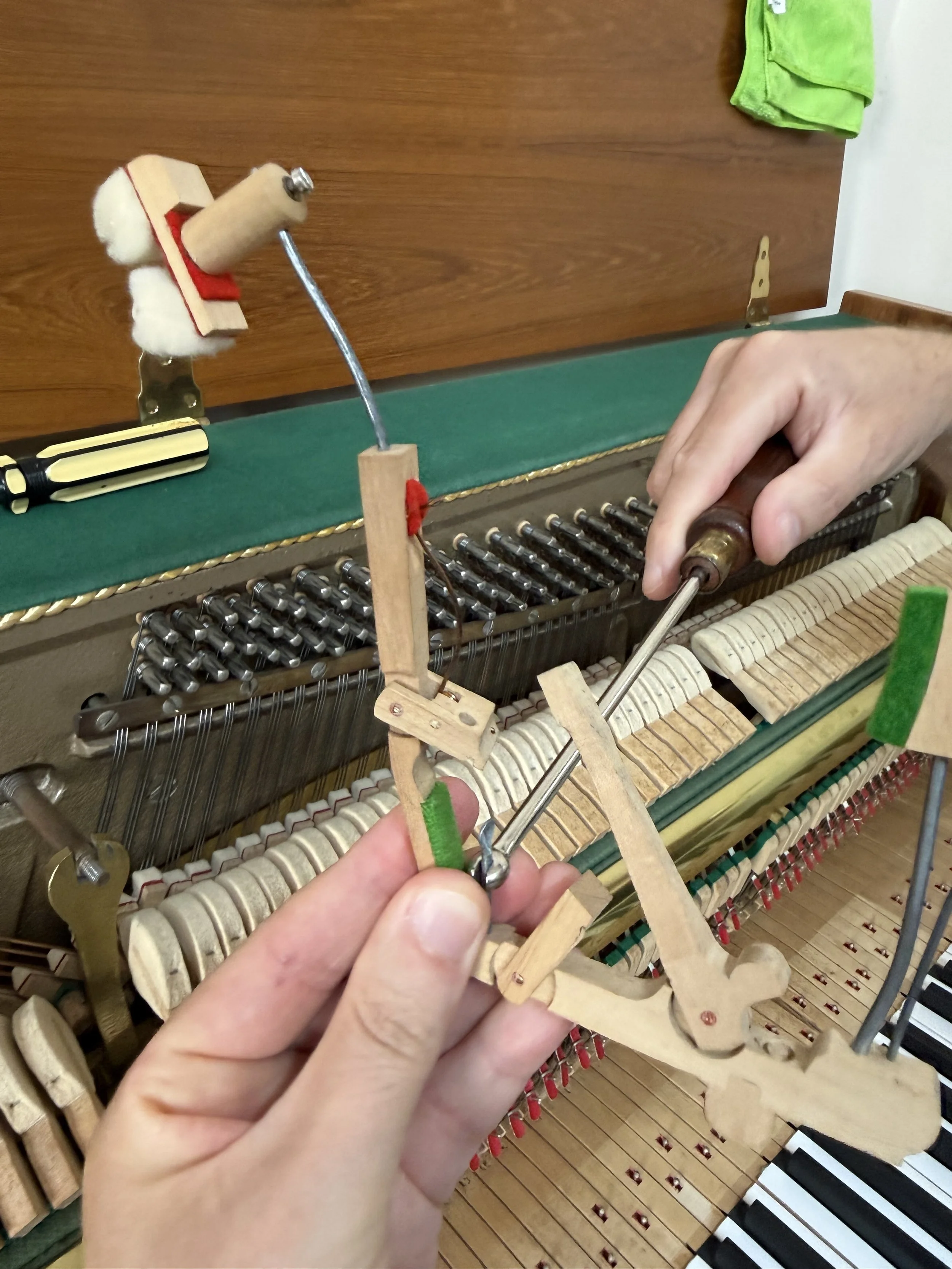 Piano damper spoon adjustment