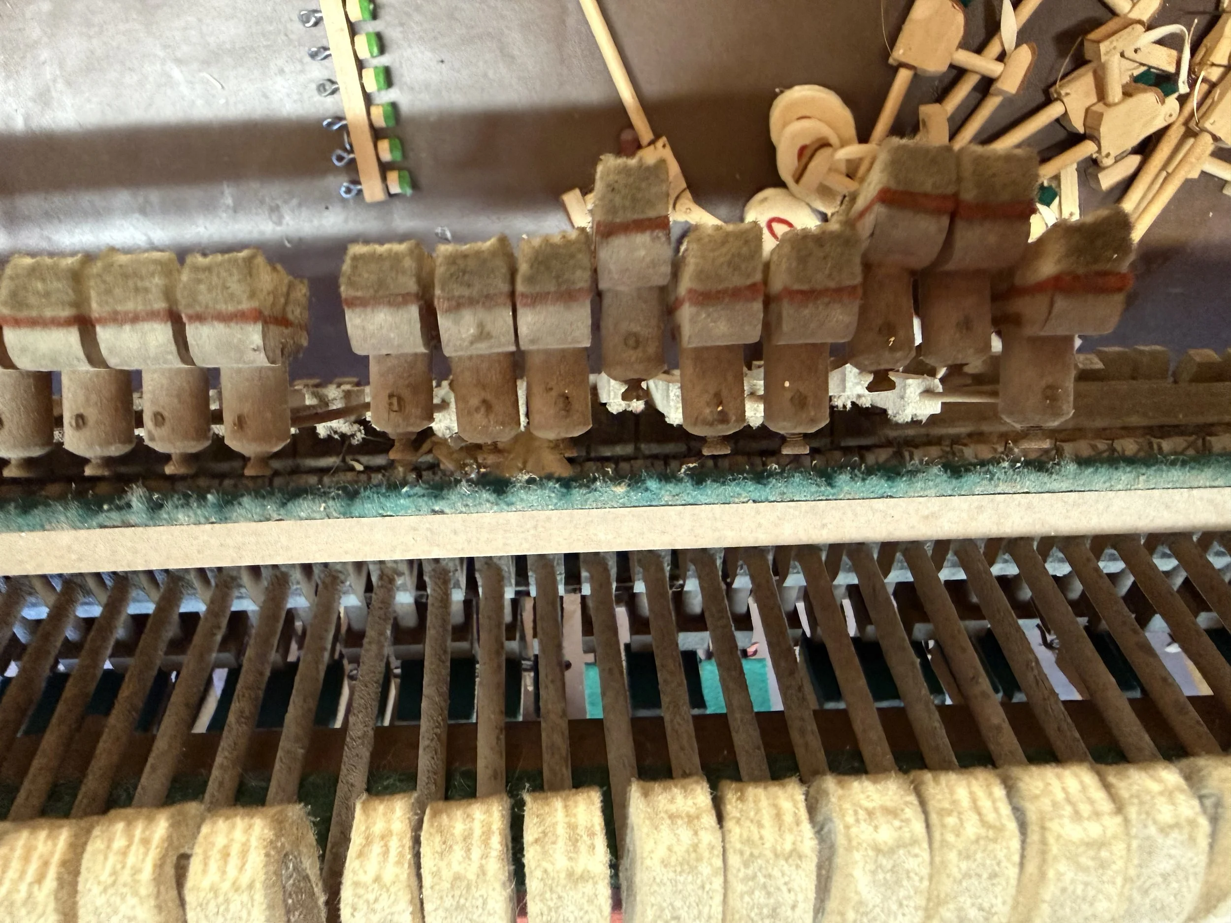 A tired old piano action getting some TLC